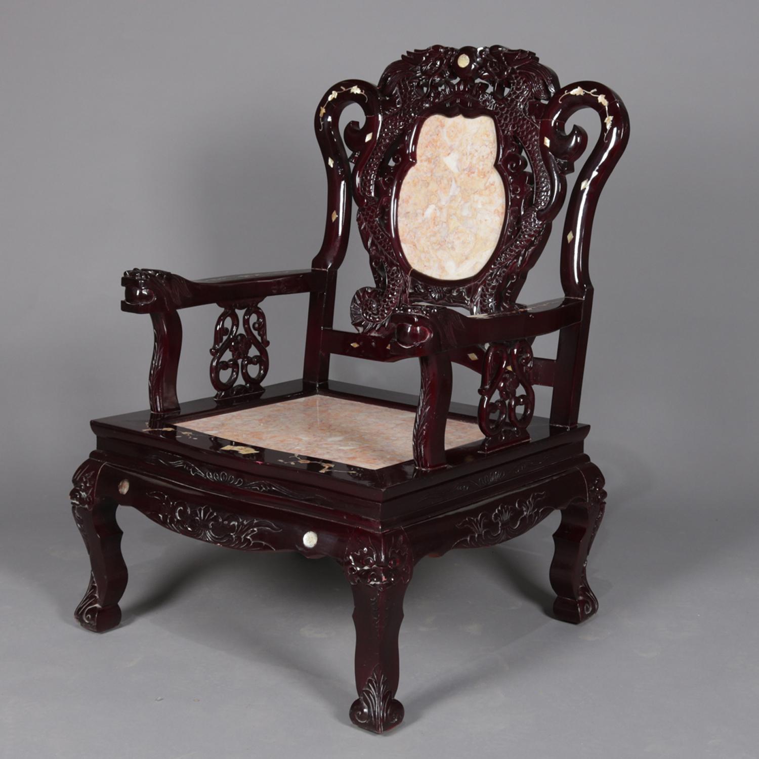A set of four figural Chinese armchairs features inset marble seats with backs framed in dragons and having flanking scroll form supports with mother of pearl inlay featuring foliate elements surmounting hardwood base having carved foliate skirt and