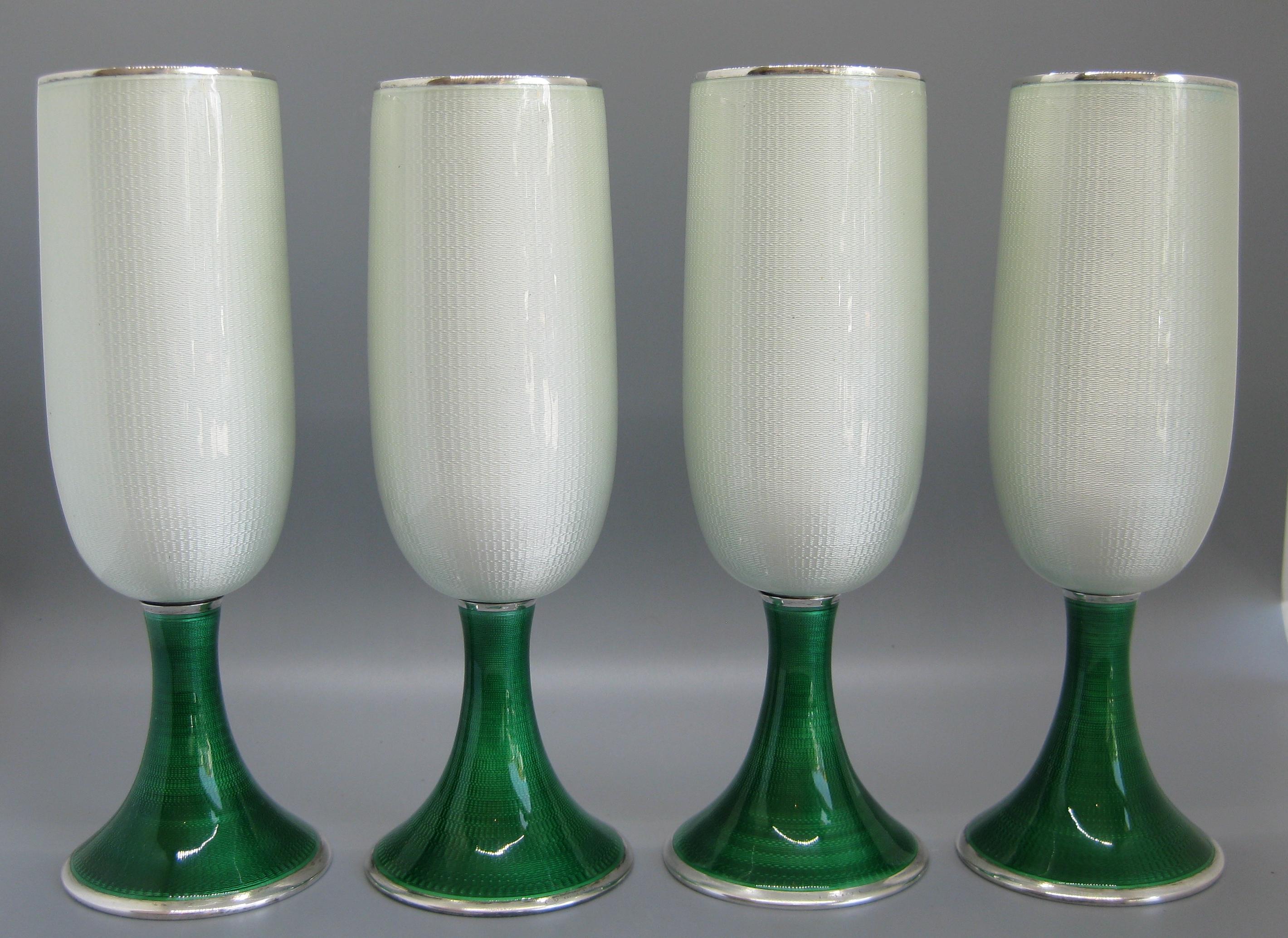 Exquisite set of 4 Gucci of Italy .925 sterling silver with guilloche enamel champagne flutes or goblets. These are finely made by a Florence silversmith for Gucci. The lower edge has the makers hallmarks and then marked 