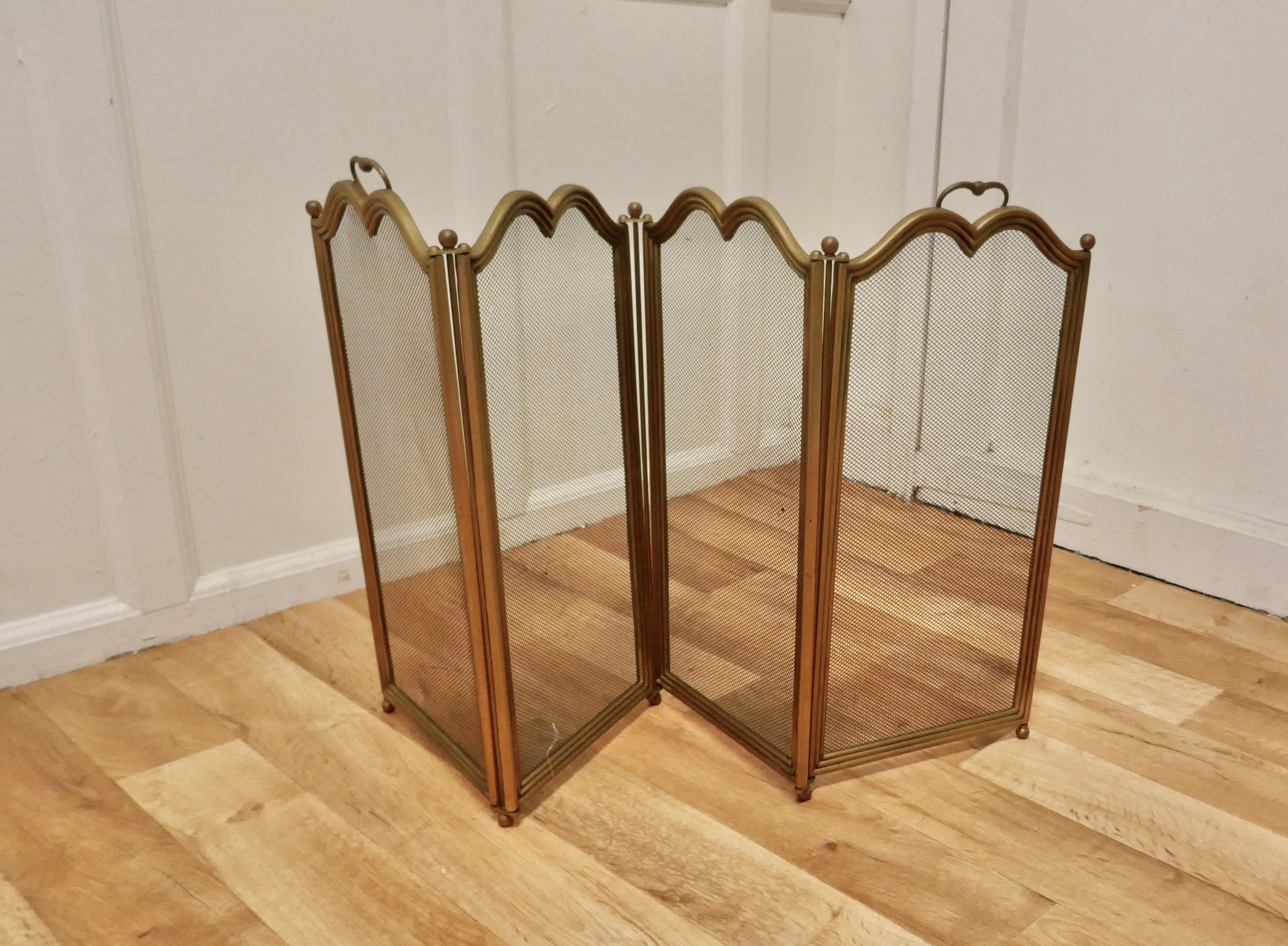 4 Fold Brass Fire Guard for Inglenook Fireplace

This very useful spark guard has a 4 fold brass frame and a fine mesh infill with a wavy brass border along the top and 2 carrying handles.
When opened out the screen can be shaped to enclose your