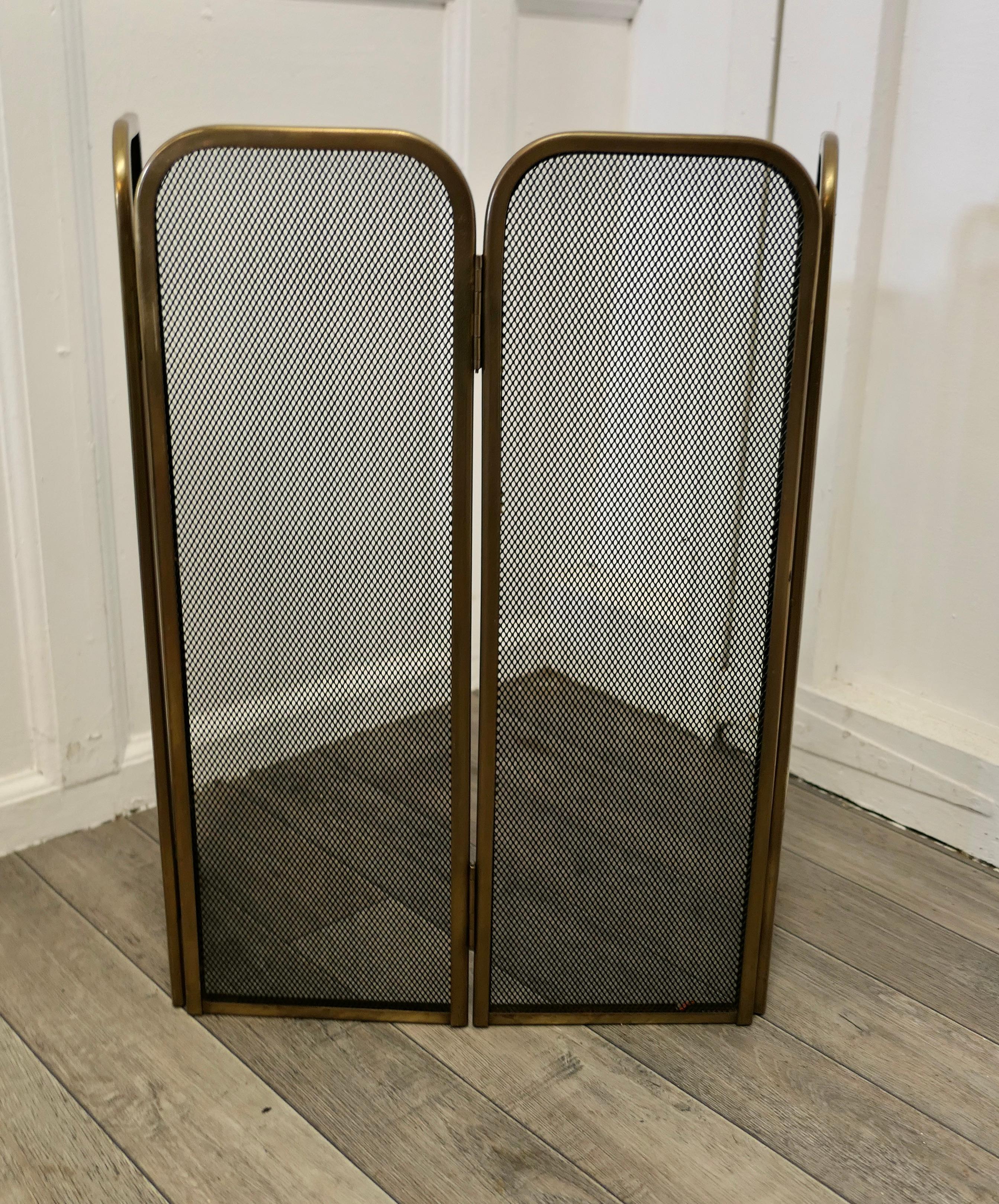 4 fold brass fire guard screen

This very useful spark guard has a brass frame and a fine mesh infill, it has the added advantage that it folds flat for storage, and when opened out it can be shaped to enclose your fire, very useful for a wood