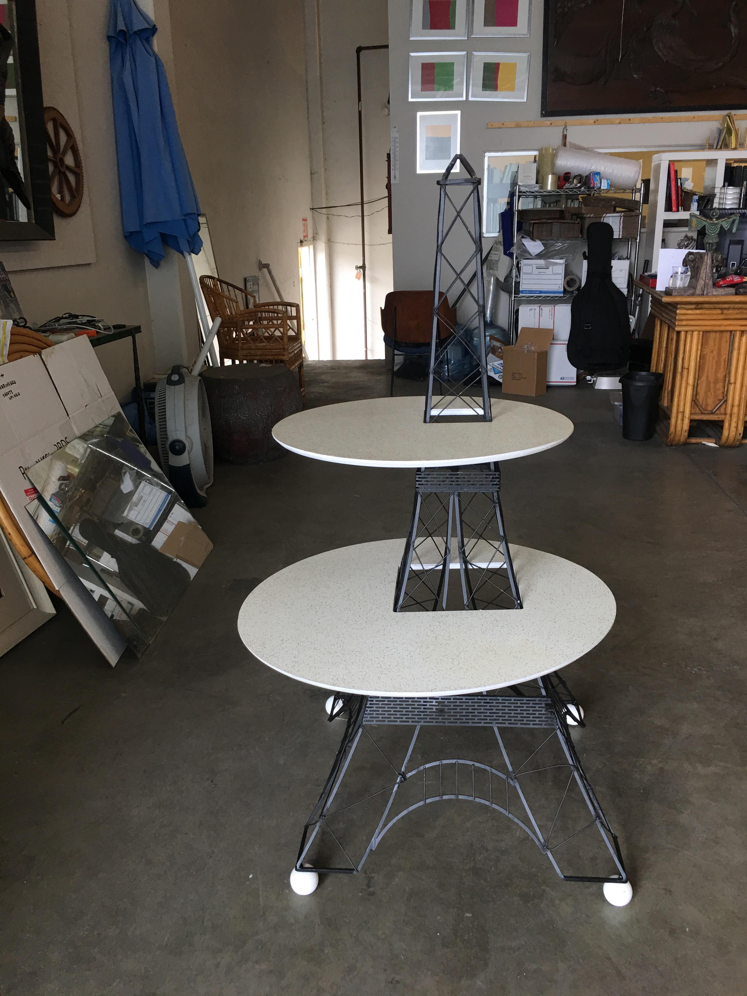 Mid Century era 2 tier Eiffel Tower sculptural side table made with a black painted solid brass wireframe table base and 2 Formica platforms. Table measures over 4' foot tall.

Dimensions: 49