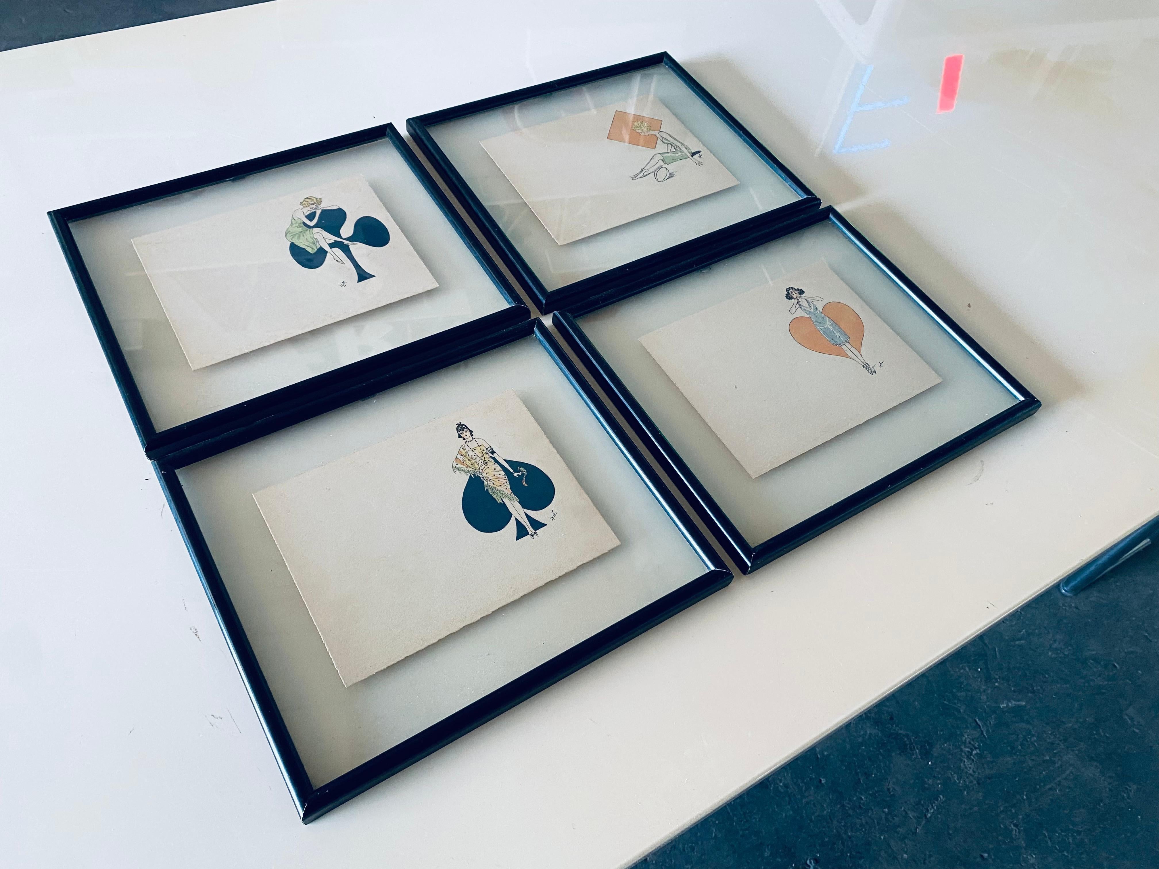 These 4 framed lithographs show Art Deco ladies in front of playing card motifs. They are each signed at the bottom right.
Since the motifs are located on the right side of the picture, one can assume that they are former greeting cards. On the left