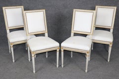 4 French Louis XVI Style Distressed Paint Decorated and Gilt Dining Chairs