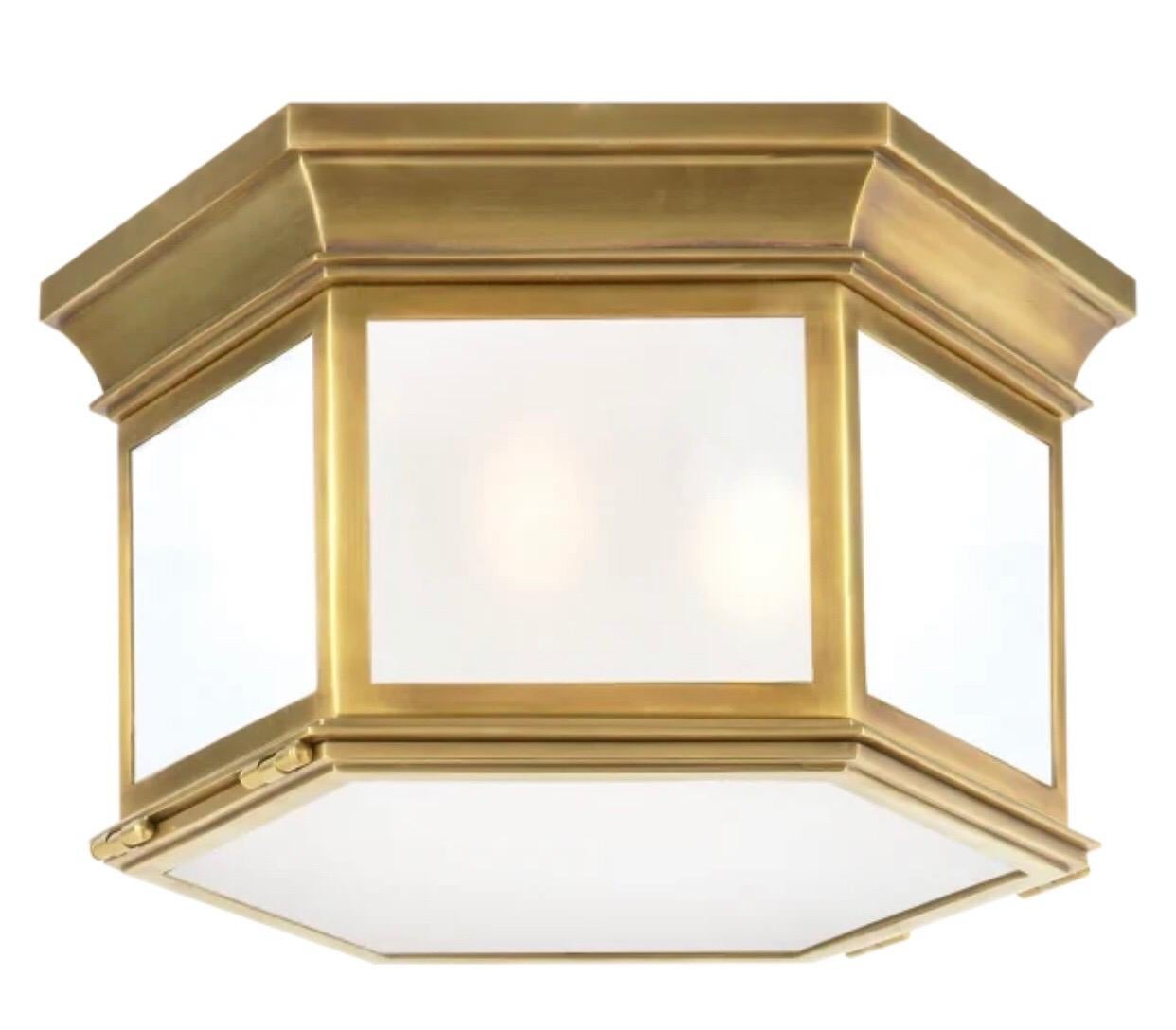 4 Elegant French Mid-Century Modern Neoclassical style antiqued brass flush mount fixtures in a hexagonal pattern and with satinized glass. The pieces are in the style of Jacques Quinet and can also be customized with clear glass and / or in a