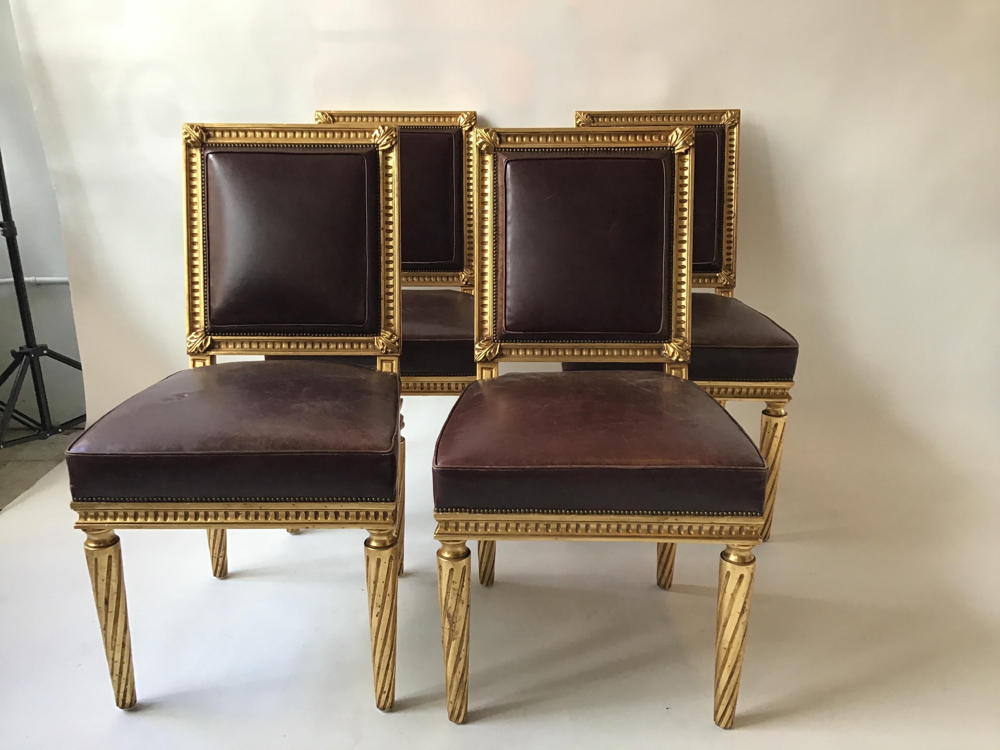 4 French style Louis XVI giltwood and squared leather dining chairs. Nice quality. From an East Hampton, NY estate.