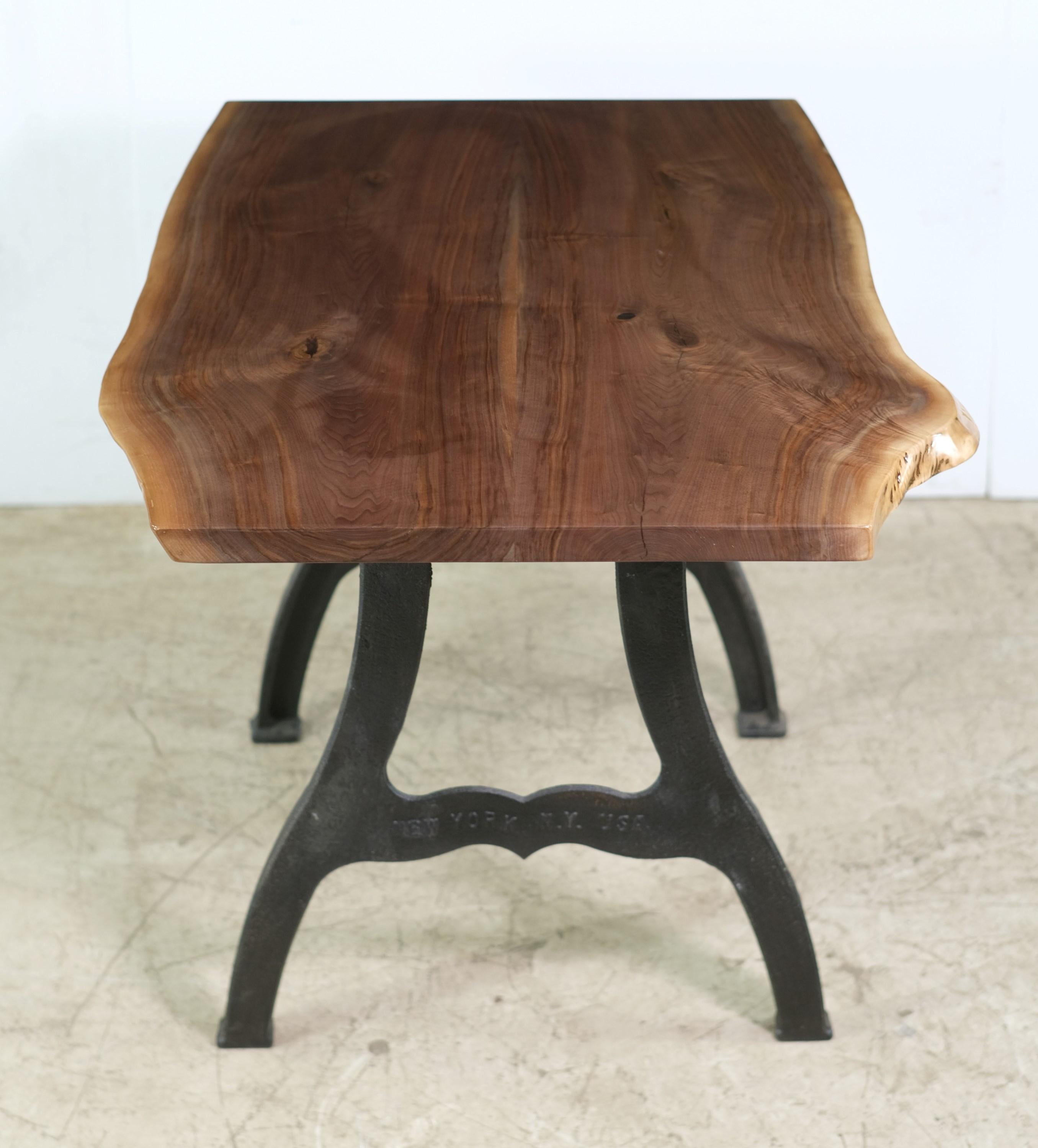 This table features a two slab live edge solid walnut top paired with New York, NY Industrial style cast iron legs. This table is ready to ship. Please note, this item is located in our Scranton, PA location.