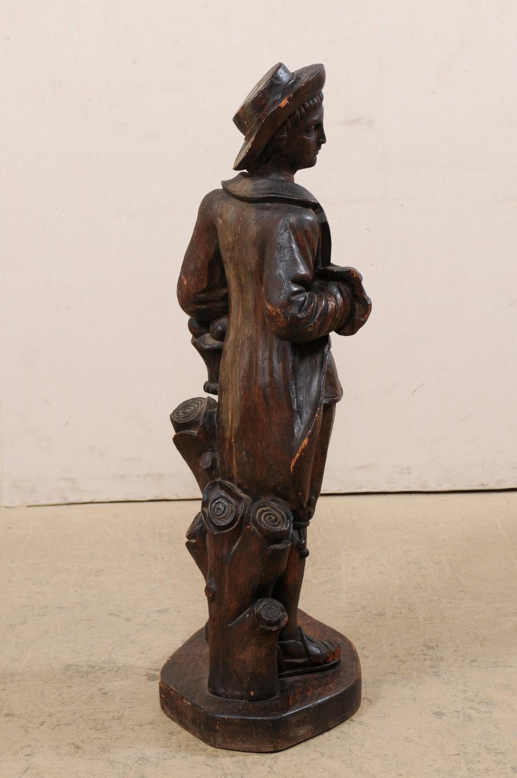 Italian Carved-Wood Statue of Male Figure holding a Basket, Mid 20th For Sale 1