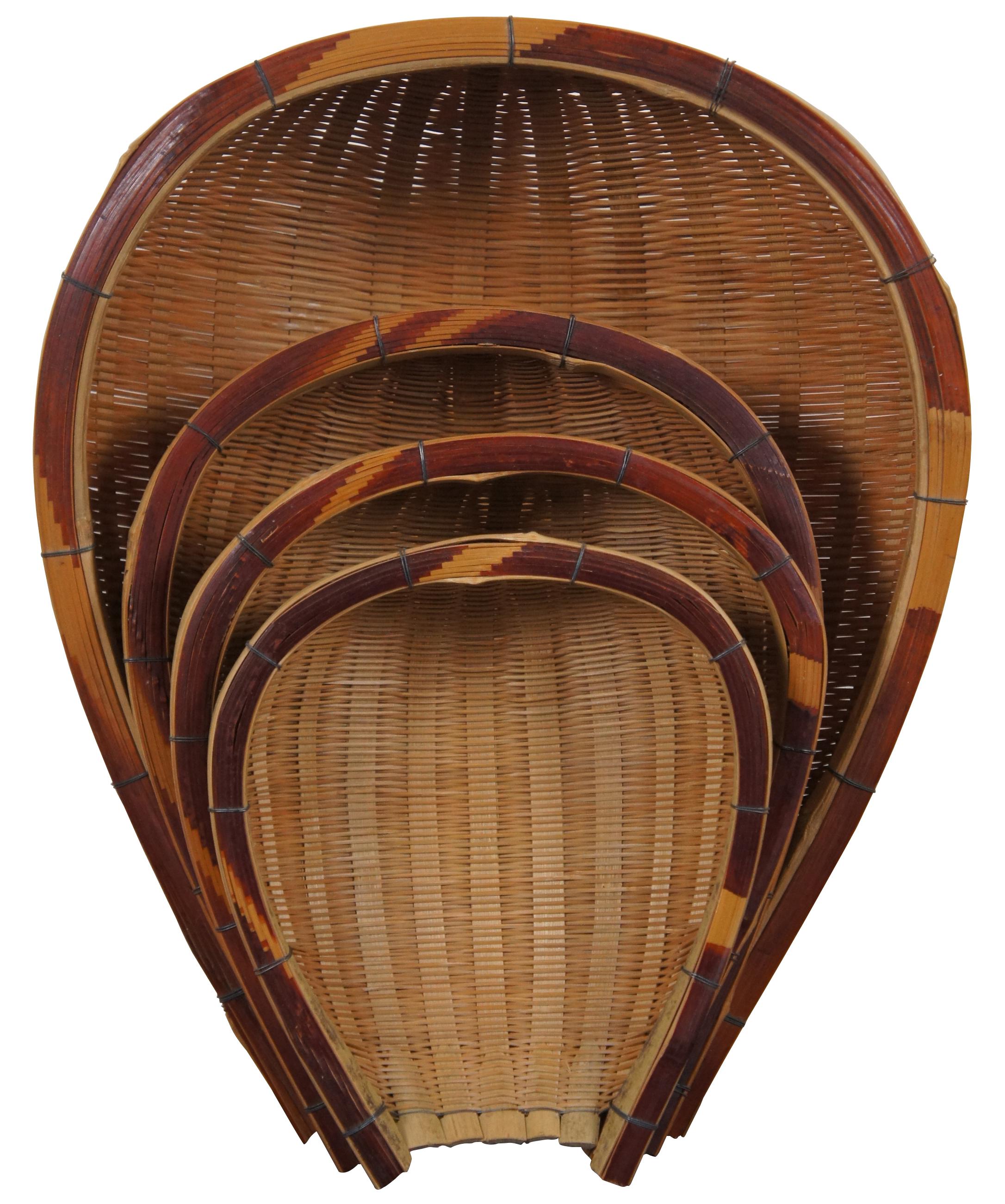 Set of four hand woven nesting baskets in the shape of dust pan, fruit bowl or shovel.

Measures: Largest - 16” x 13” x 4.75” / Smallest - 8.75” x 7.5” x 2.75” (Length x Width x Depth).
 