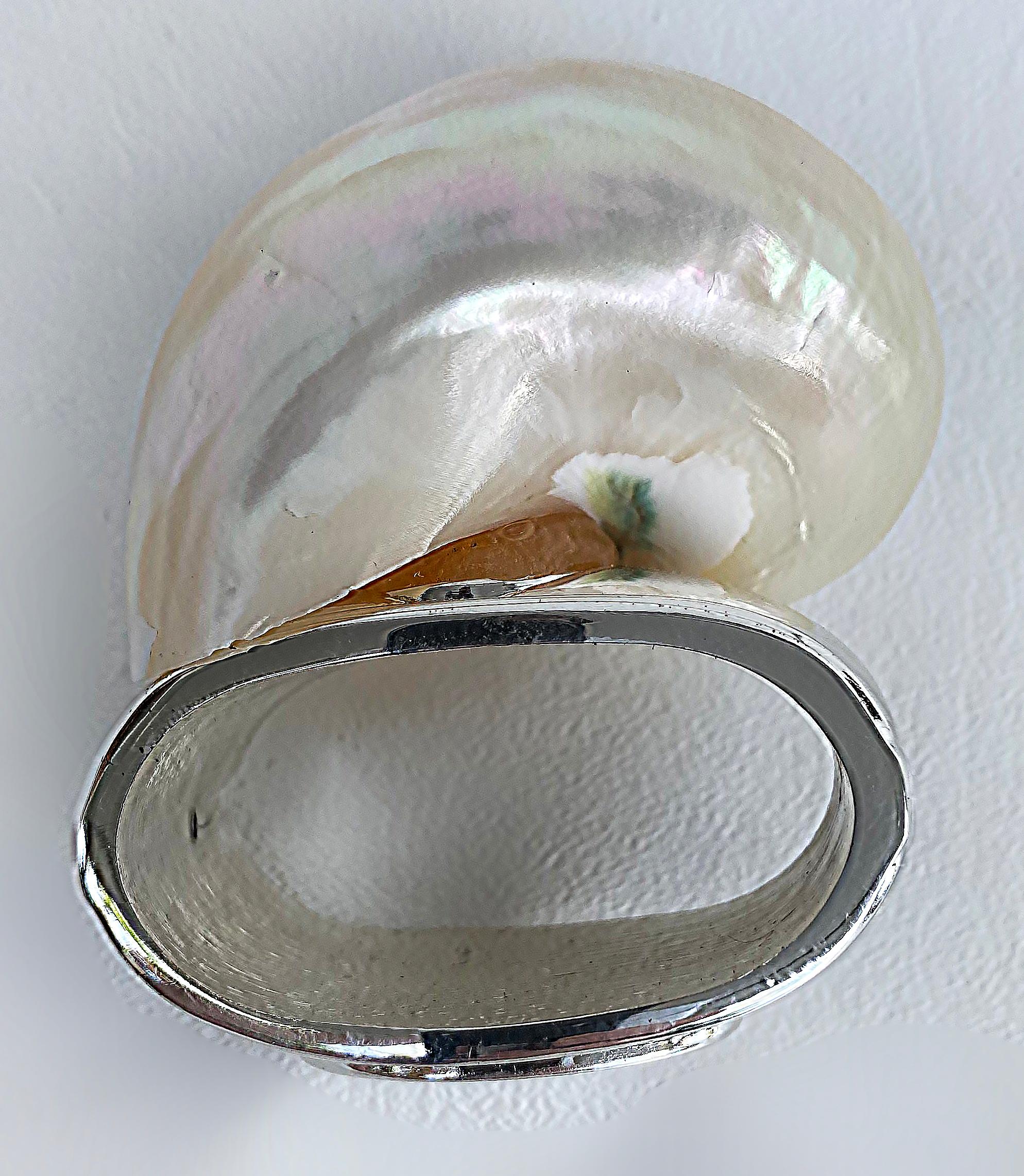 4 Hans Turnwald Sea Shell Silverplate Napkin Rings with Original Box

Offered for sale is a set of four Hans Turnwald seashell and silverplate napkin rings presented in their original box.  They are quite elegant and will make a lovely gift when