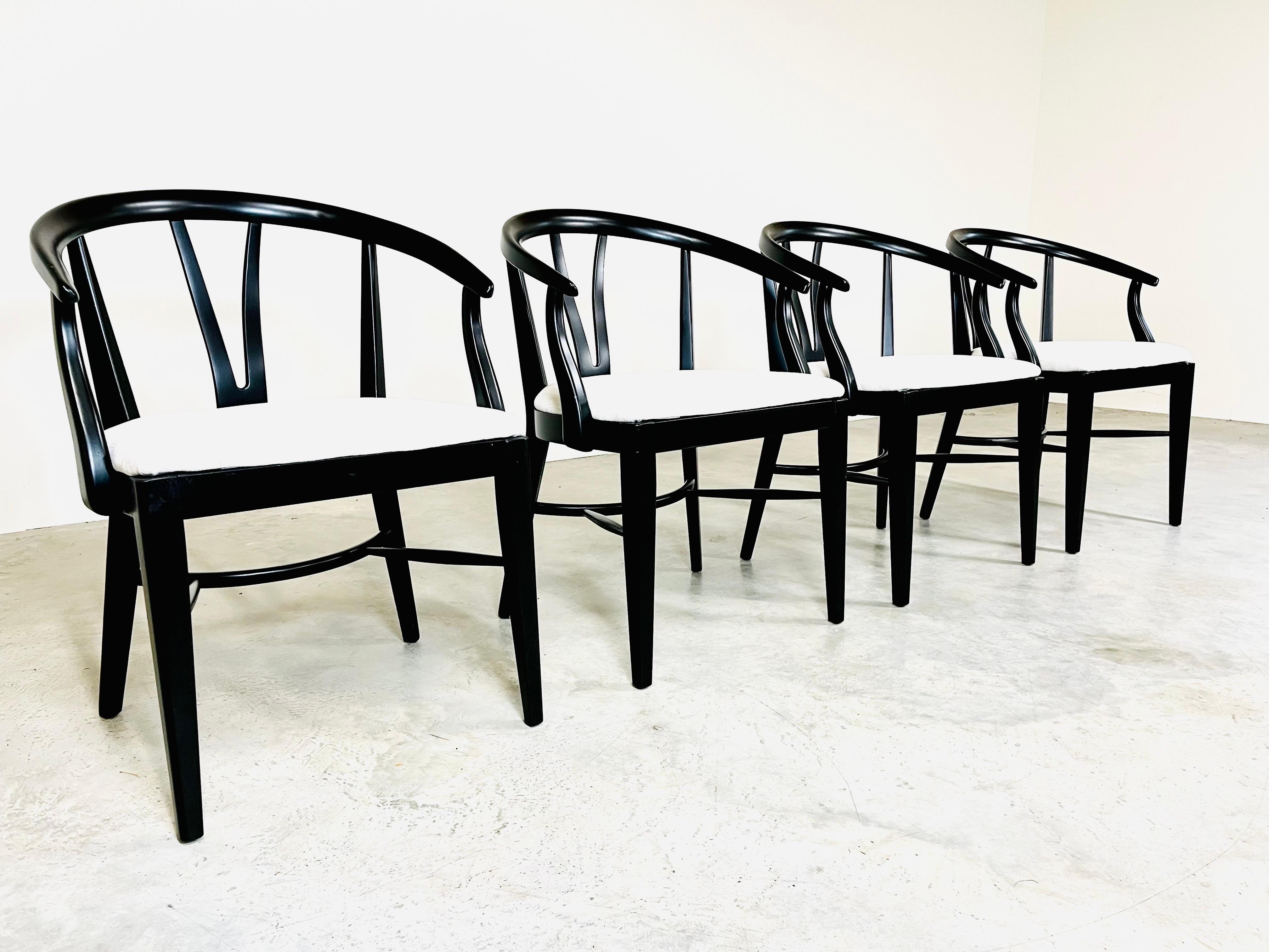 A set of 4 sculptural curved back armchairs in the manner of Hans Wegner’s Wishbone chair having black lacquer finish with brand new chenille fabric with fresh cushioning. All chairs are signed with original Blowing Rock of N.C. tags, are solid and