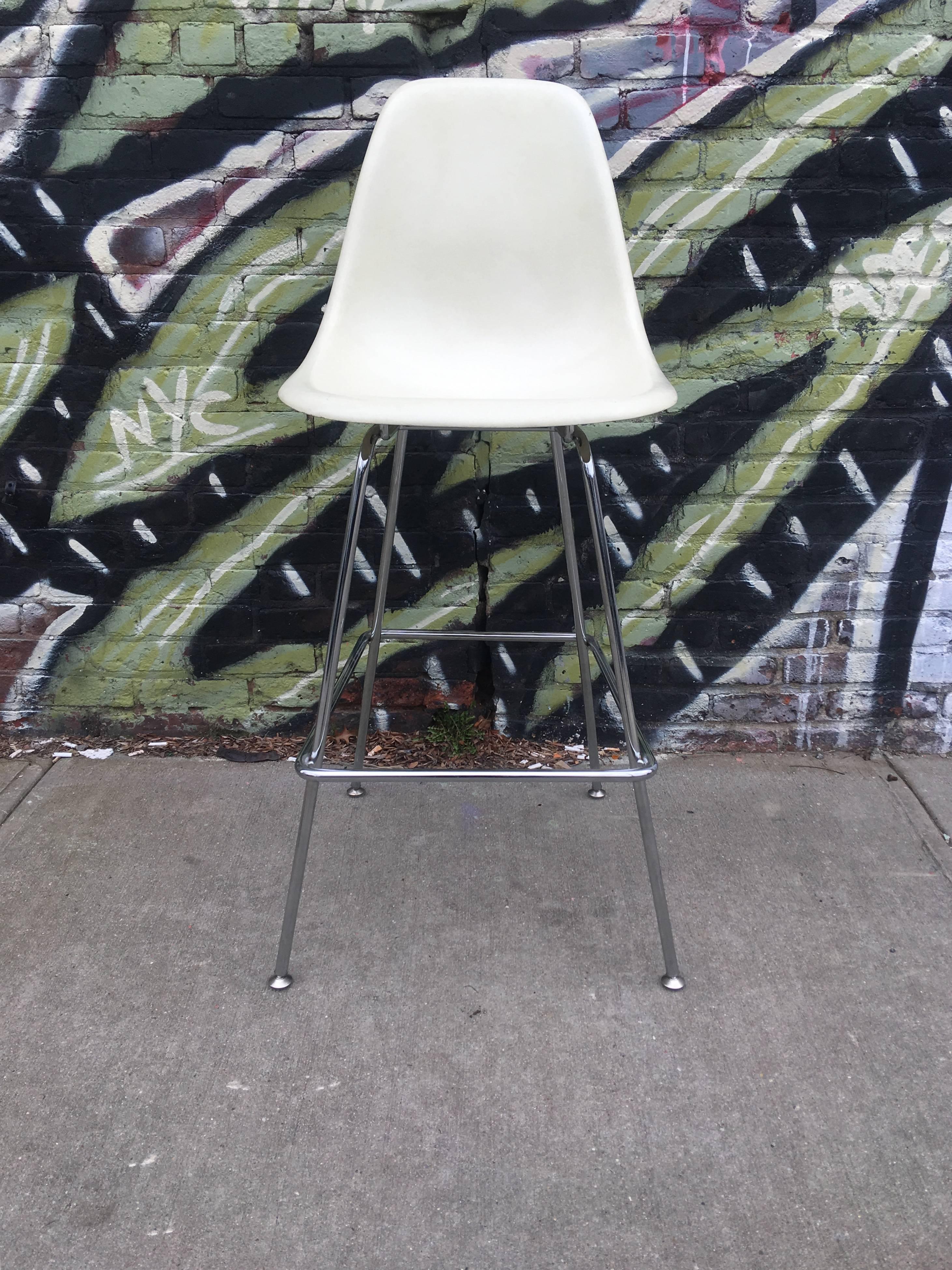 Four Herman Miller Eames barstools. Vintage shells on newer bases. Shells in excels t vintage condition. Bases have no rust or bends. Extremely comfortable and sturdy.