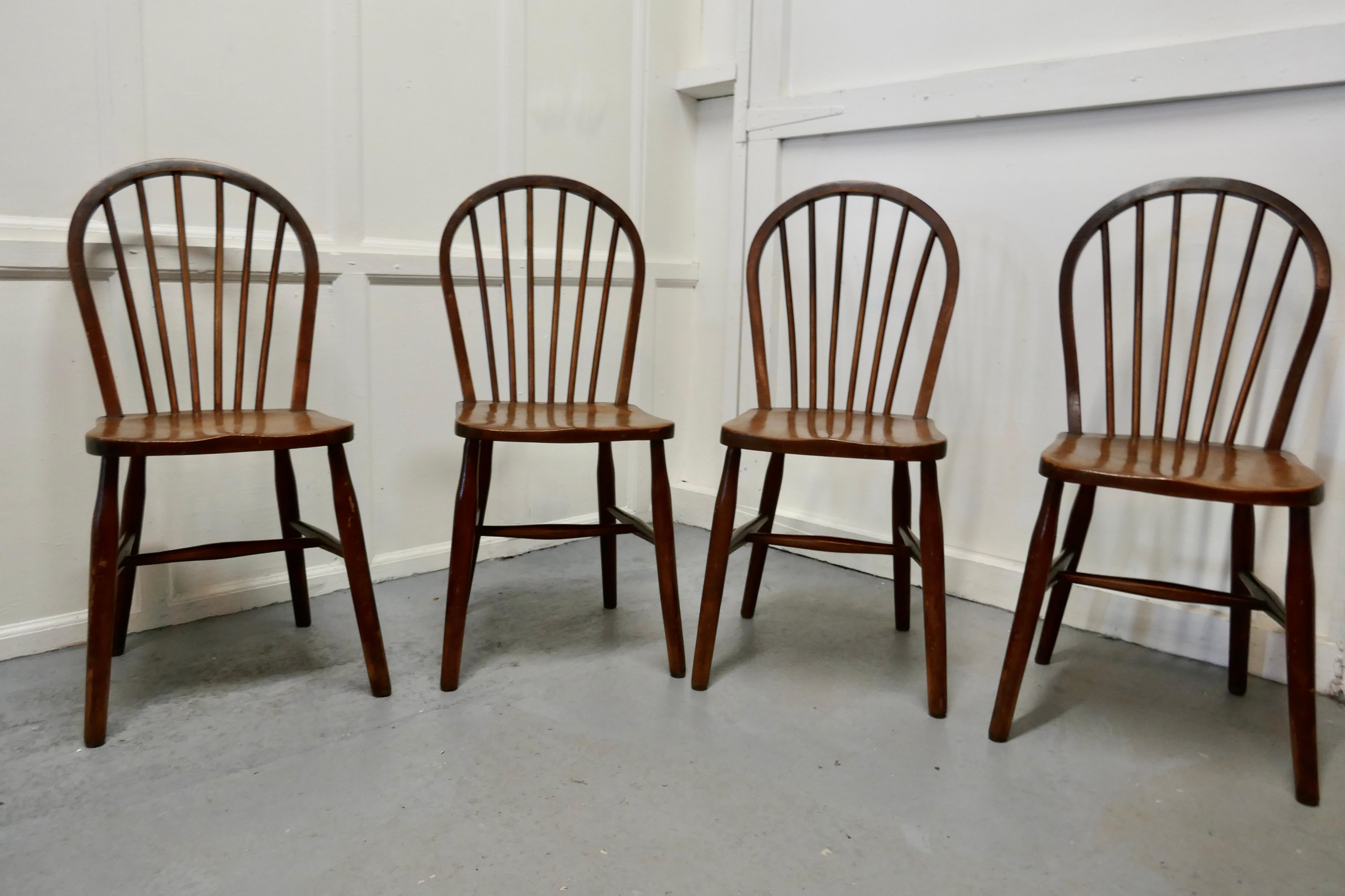 4 high Wycombe beech & elm hoop back Windsor chairs

The chairs are a classic design and traditionally made from solid wood they have hoop backs in the traditional Windsor style with spindles 
 
These are very sturdy chairs, the joints are all