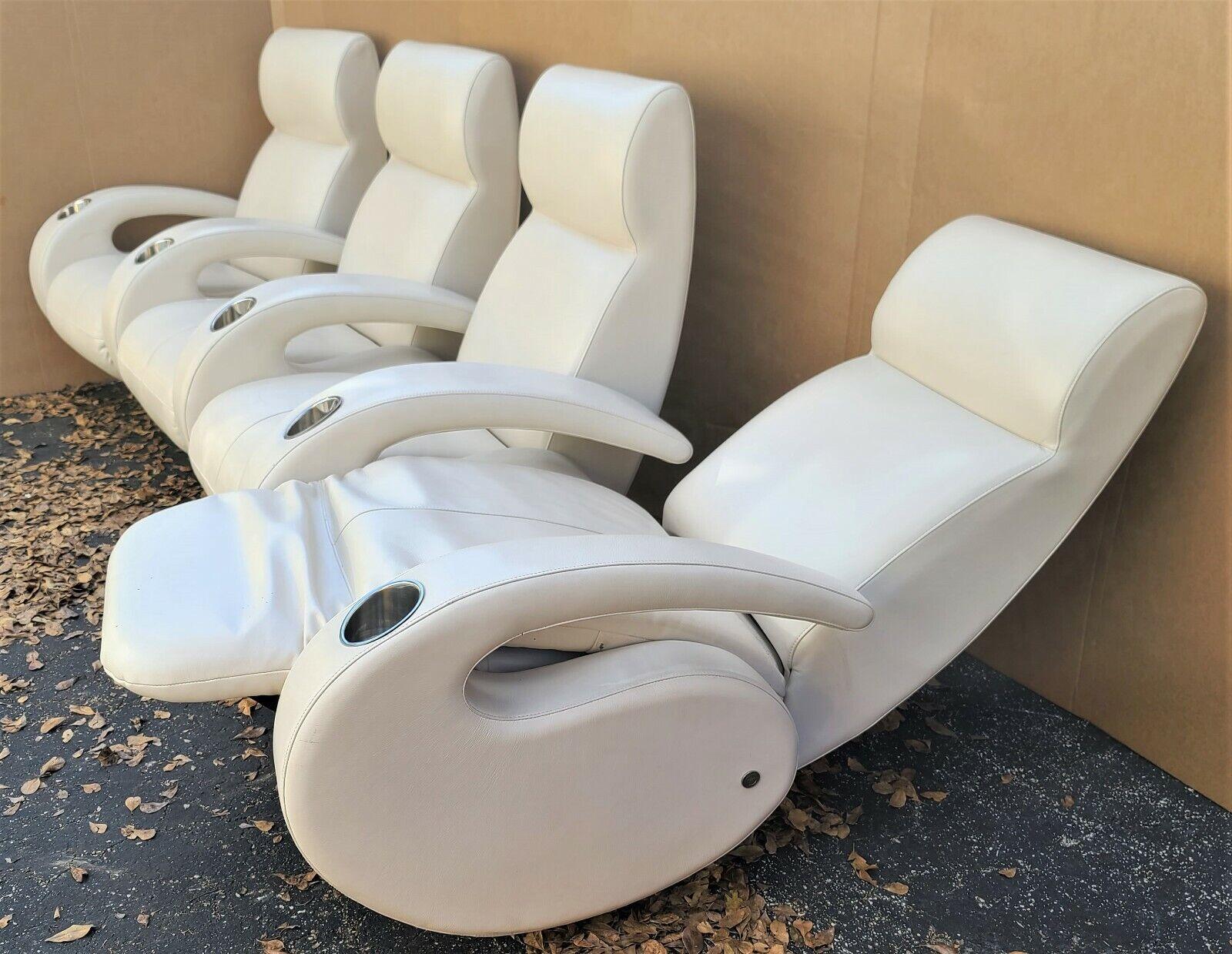 Offering one of our recent palm beach estate fine furniture acquisitions of a
4 seater home theater odyssey recliner by Rick Lee for American Leather 

Approximate measurements in inches
122