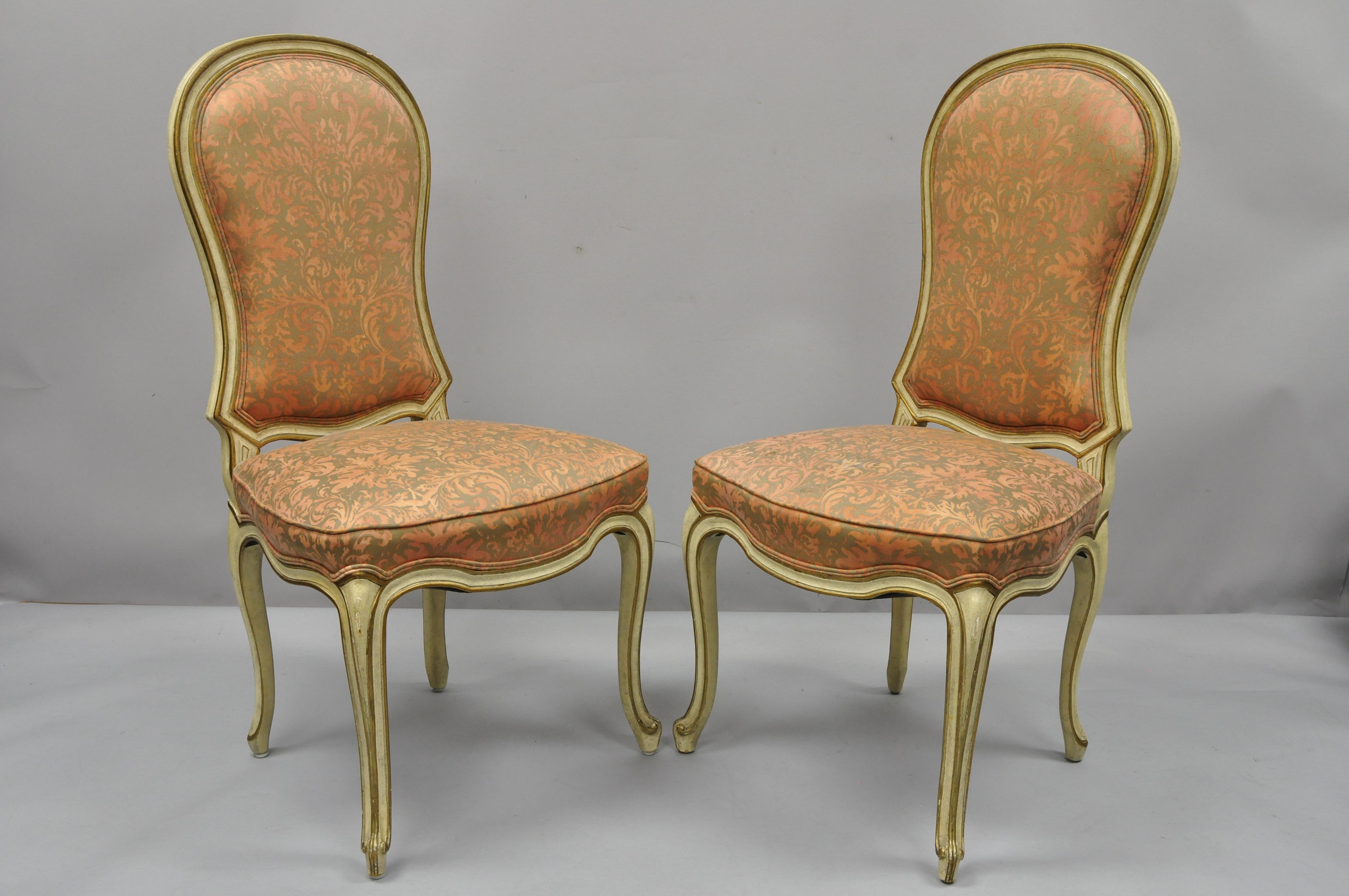 4 vintage Italian Provincial French Hollywood Regency upholstered dining side chairs. Items feature solid wood construction, upholstered back and seats, distressed finish, cabriole legs, quality craftsmanship, great style and form, mid-20th century.