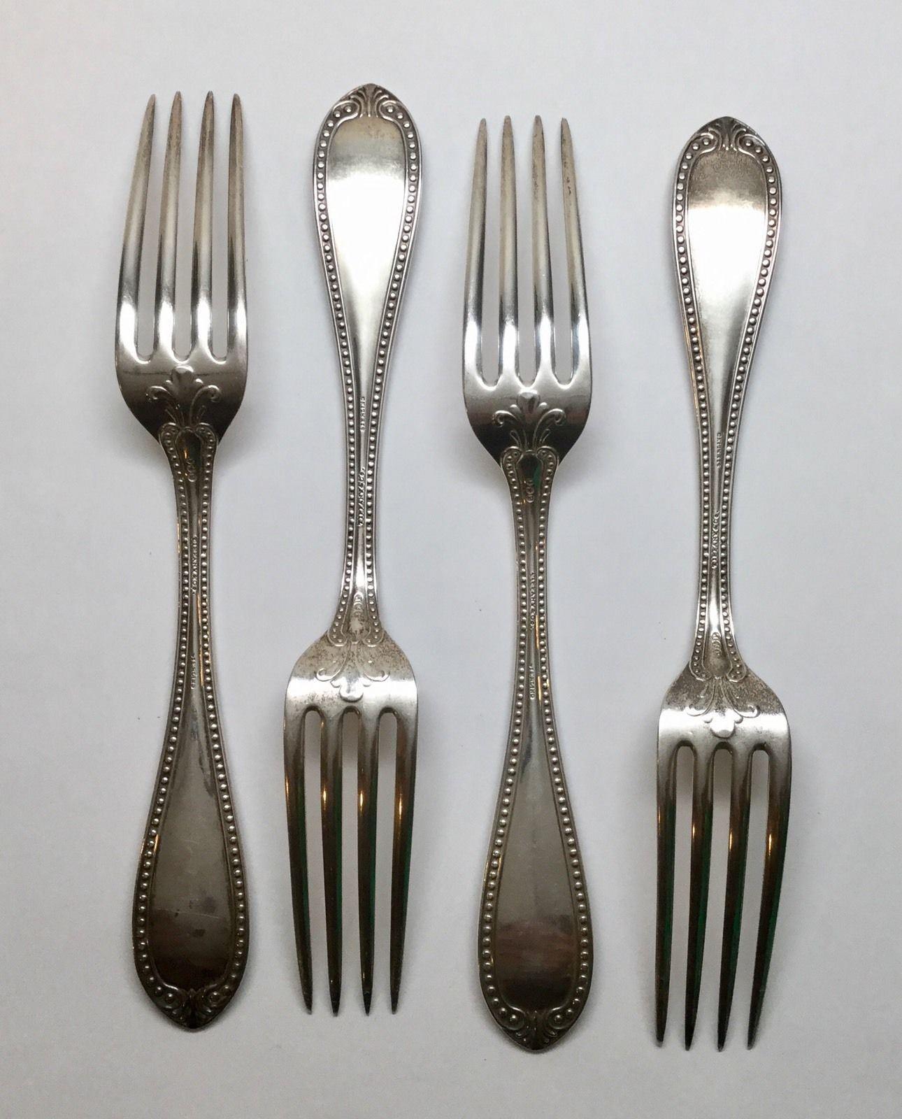 4 John Polhamus for Tiffany & Co. sterling silver forks in the 1850 Bead pattern. Marked: J*P, TIFFANY & CO., STERLING. Engraved on handle: Louisa Le Huray. Measures: 7 3/4