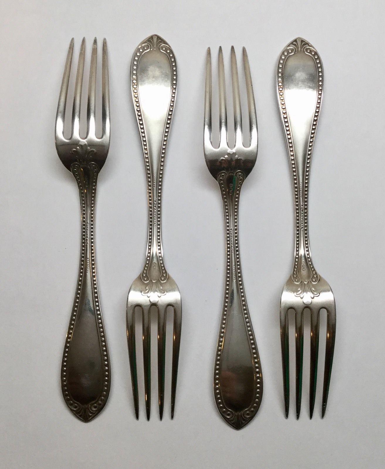 4 John Polhamus for Tiffany & Co. sterling silver forks in the 1850 Bead pattern.
 Marked: J*P, TIFFANY & CO., STERLING. 
Engraved on handles: Louisa Le Huray. 
Measures: 7