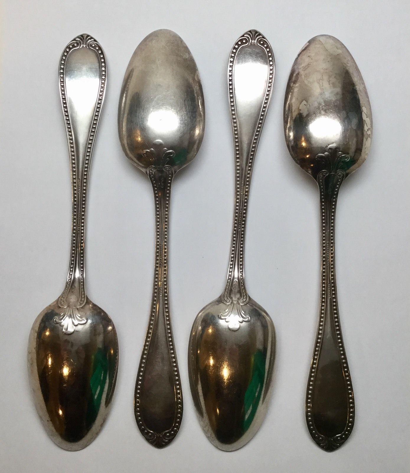 4 John Polhamus for Tiffany & Co. sterling silver tablespoons in the 1850 Bead pattern. 
Marked: J*P, TIFFANY & CO., STERLING.
 Engraved on handle: Louisa Le Huray. 
Measures: 8 1/2