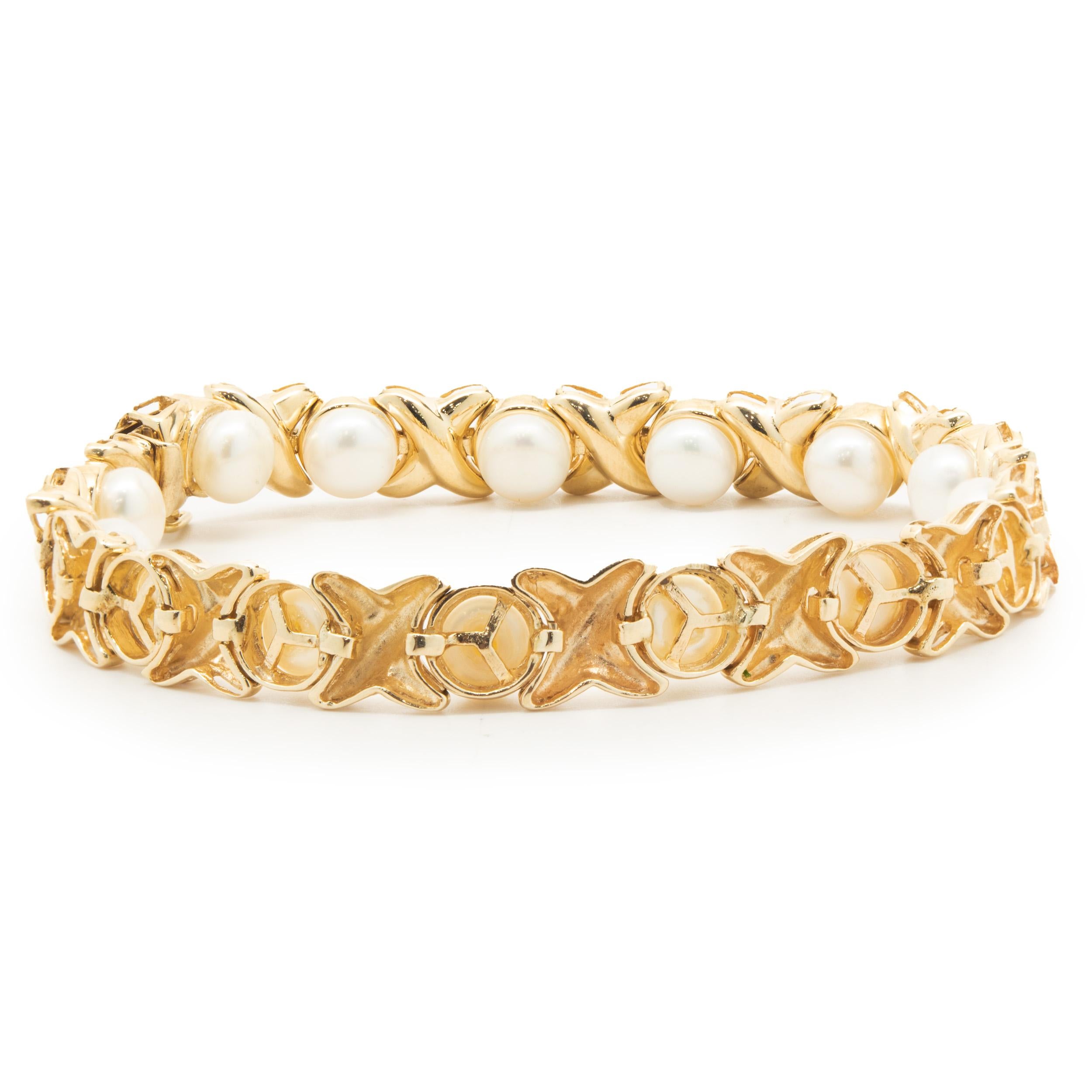 Designer: custom
Material: 14K yellow gold
Weight: 21.30 grams
Dimensions: bracelet will fit up to a 7.5-inch wrist
