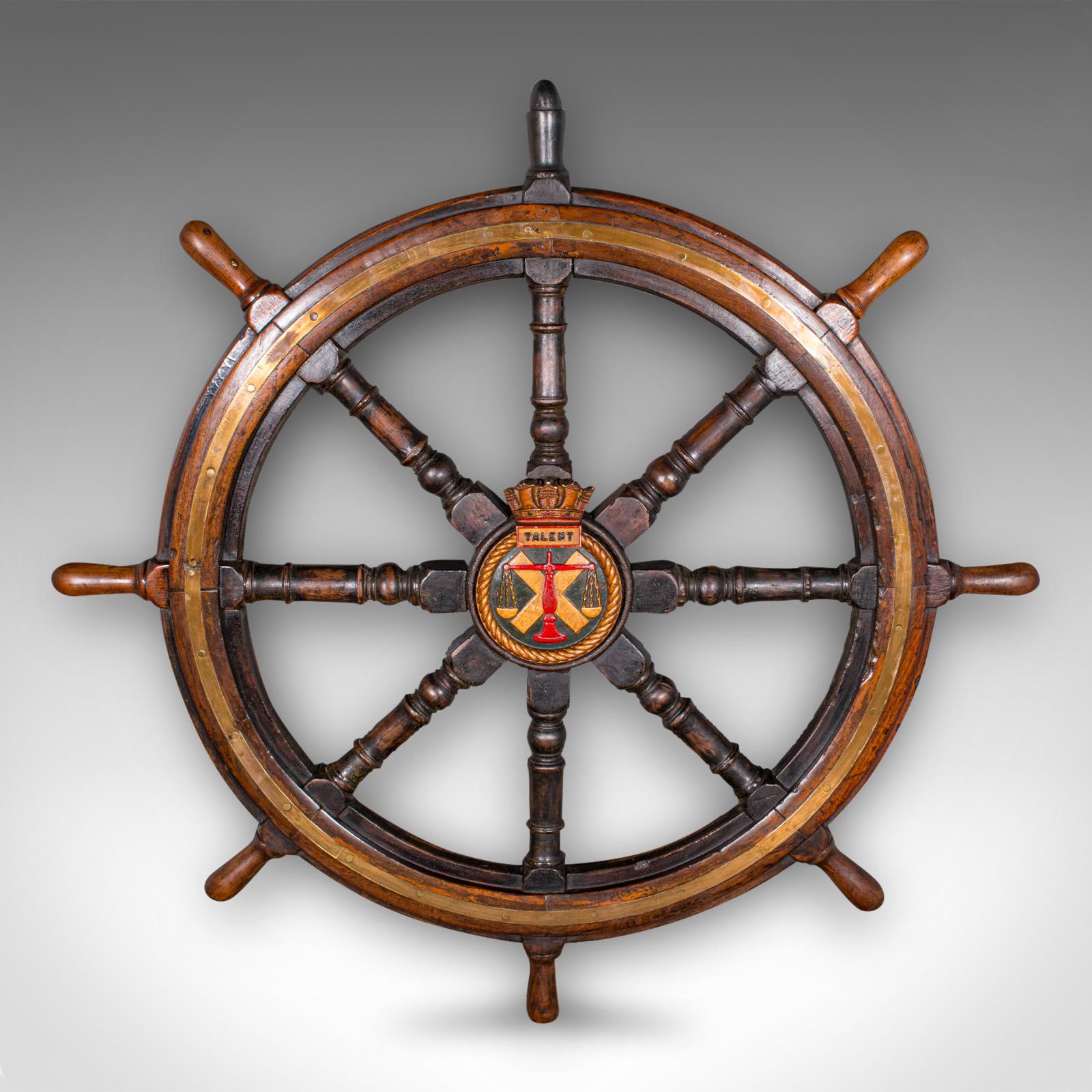This is a very large antique ship's wheel. An English, oak and bronze decorative maritime helm, dating to the late Victorian period, circa 1900

High maritime appeal with a strikingly wide diameter
Displays a desirable aged patina and in good