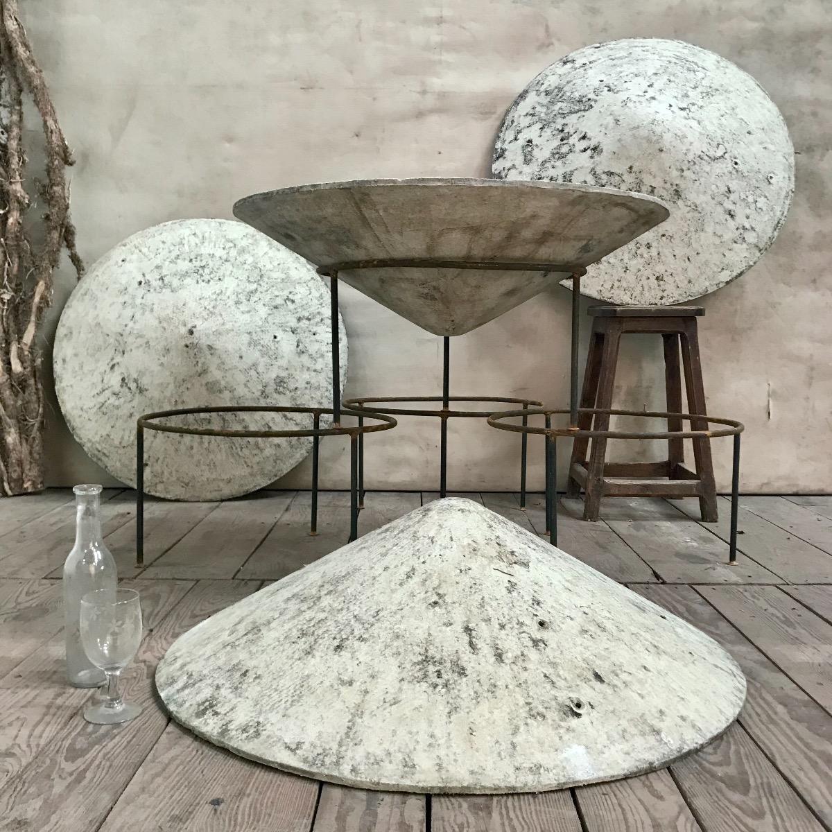 4 large Eternit saucer planters designed by Willy Guhl with wrought iron base.