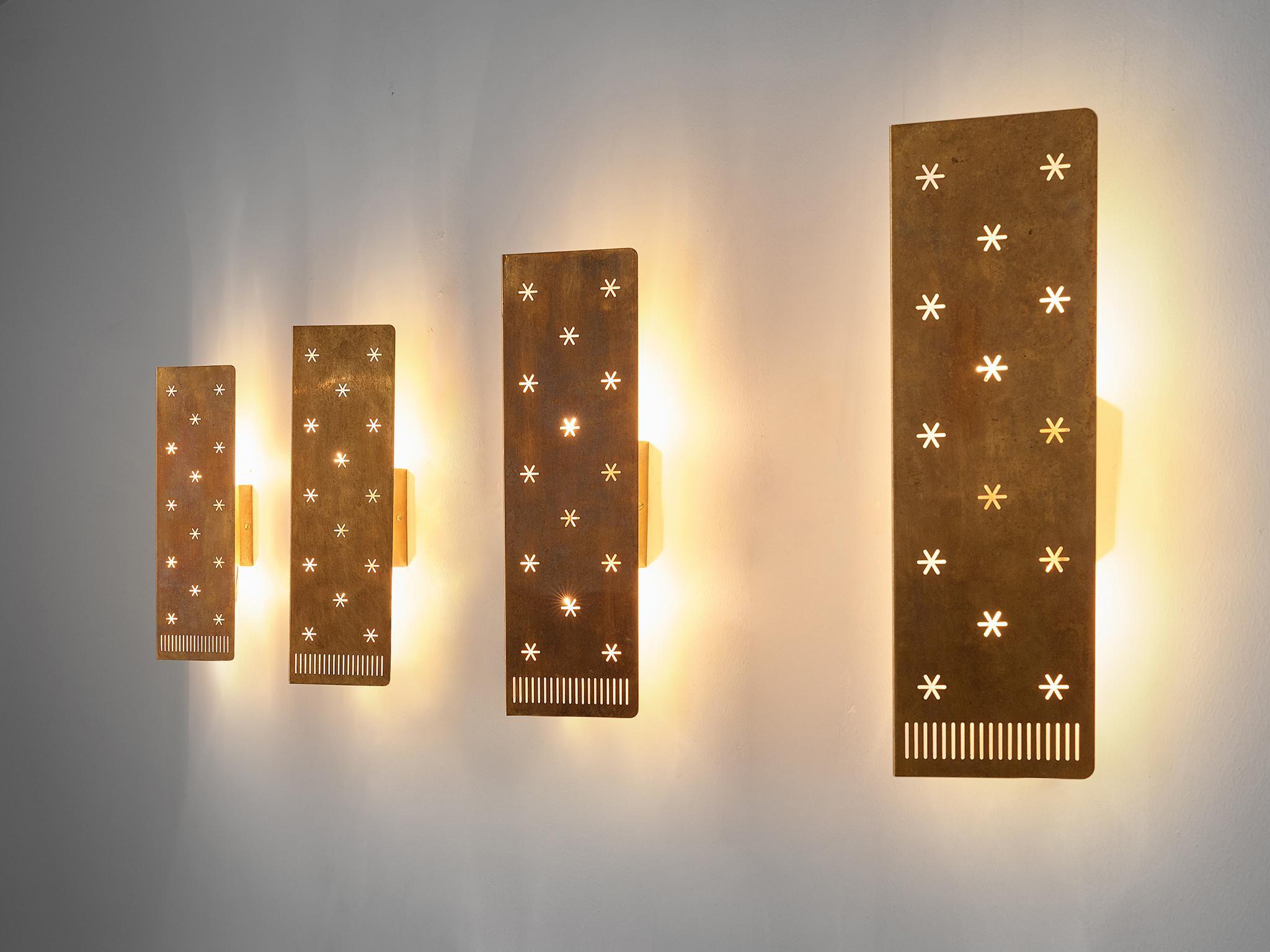 Paavo Tynell for Idman, '6200' wall lights, brass, Finland, circa 1953.

This model features a very refined design that shows Tynell's style perfectly. Use of perforated metal and polished brass were common materials and techniques he applied in