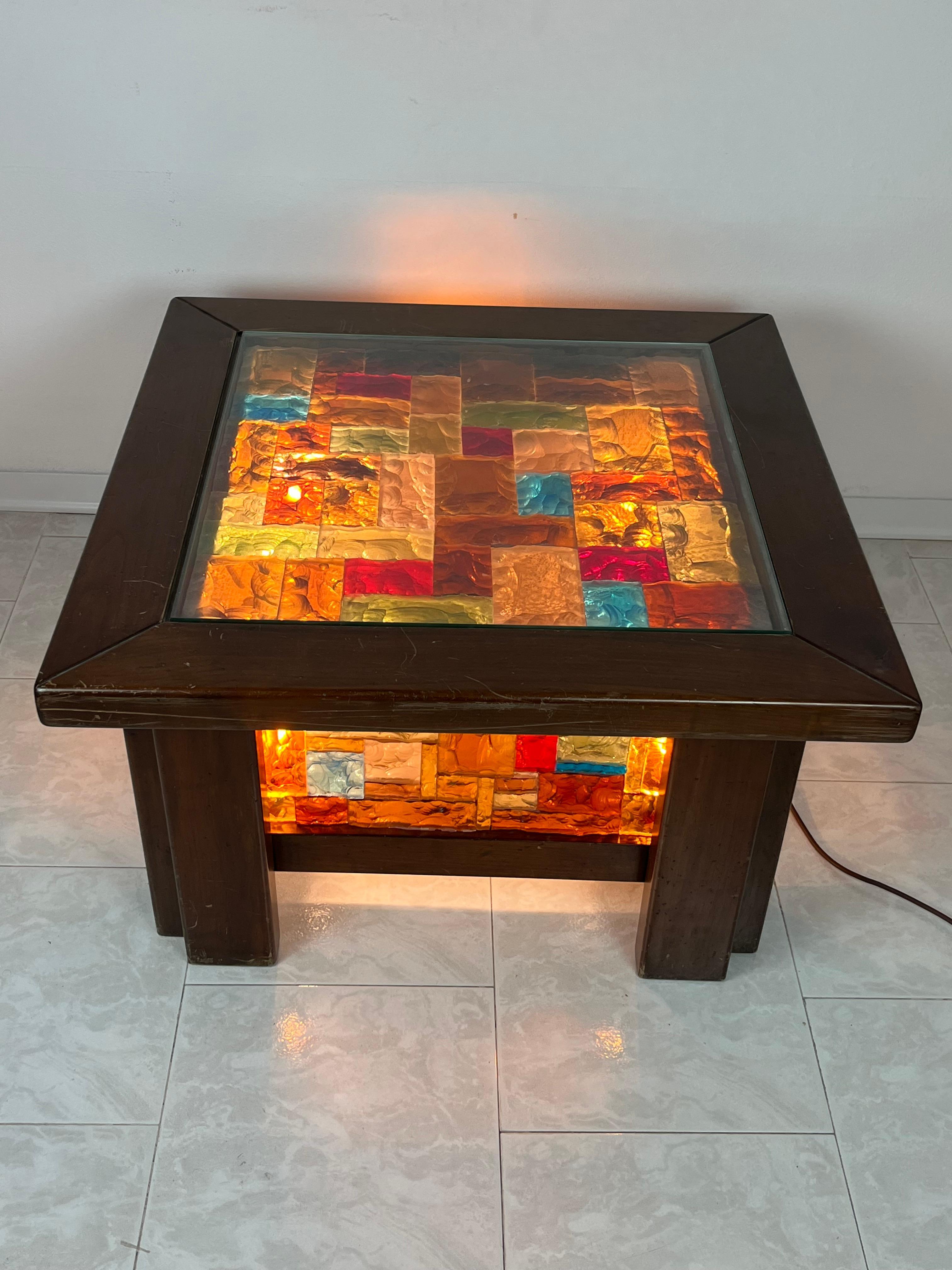4-light coffee table in wood and multicolor mosaic glass, Italy, 1980s
Found in a noble villa. It is intact and in good condition. Small signs of aging on the wood, which can be resolved with a good polishing. E 27 lamps