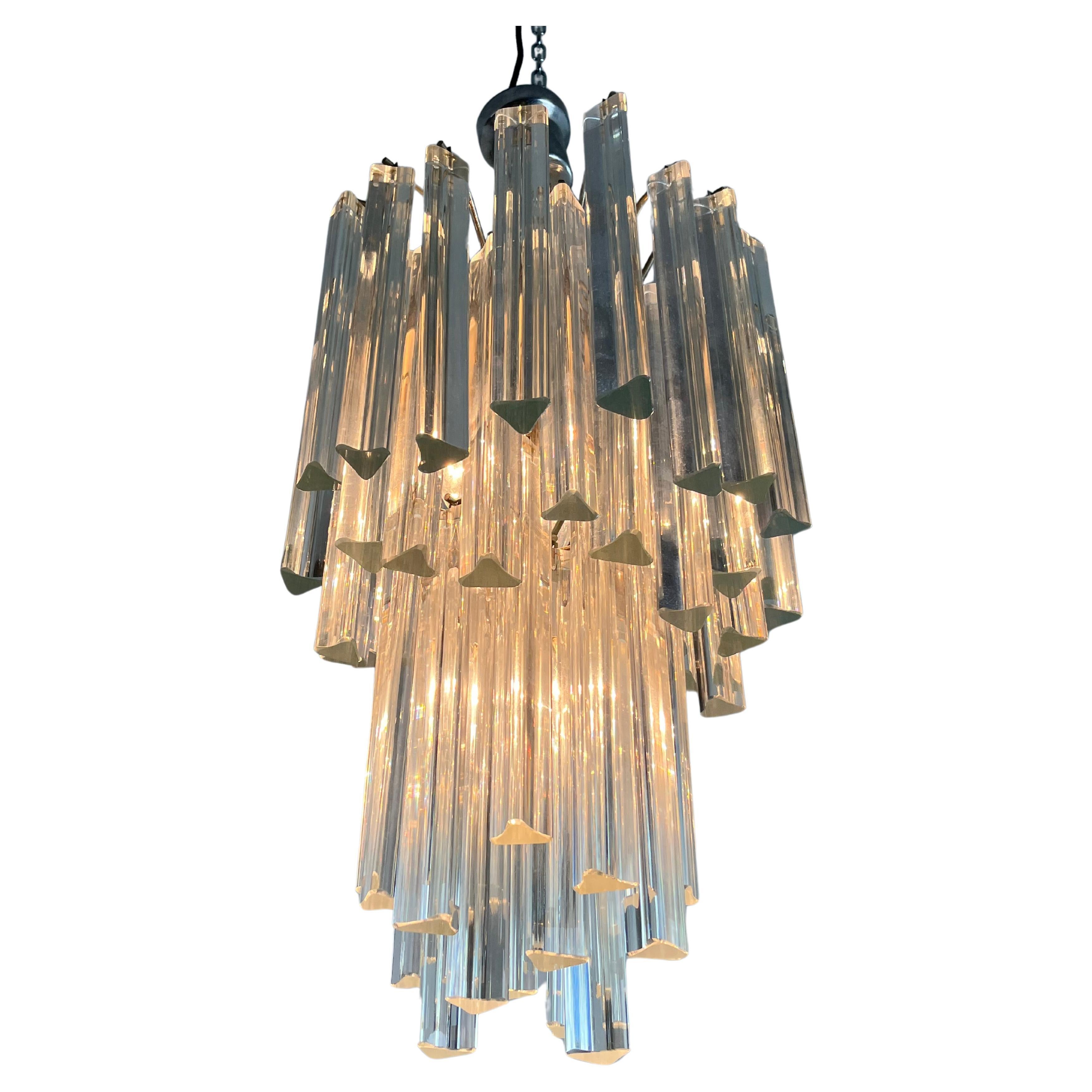 4-light Venini chandelier, Trilobi model, Mid-century Murano glass, 1960s
Purchased in Venice by my grandparents.
Metal structure. 54 glasses.
Intact and working, E14 lamps.
Small and imperceptible signs of aging.

We guarantee adequate packaging