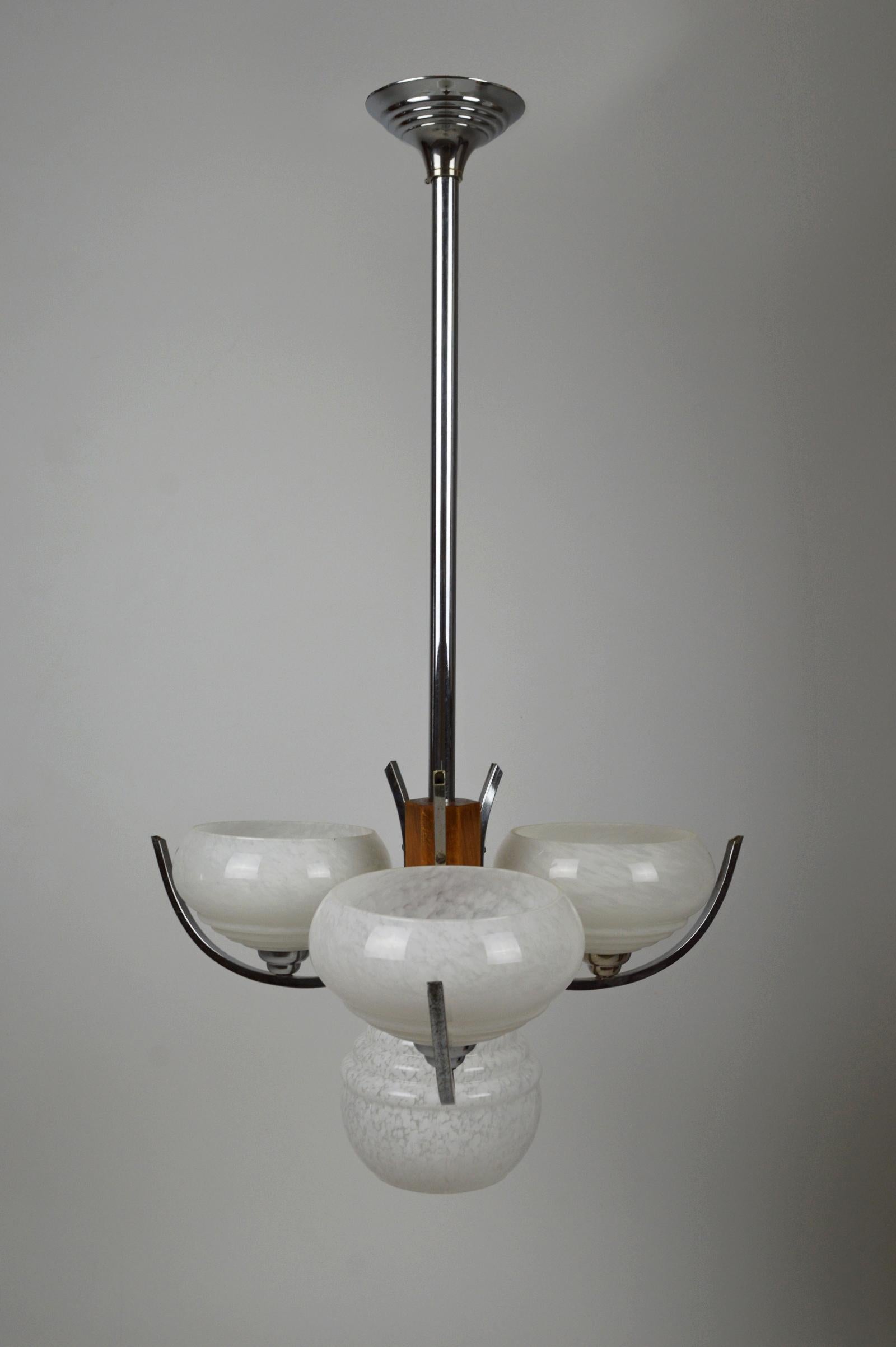 Nice modernist 4-lights and 3-arm chandelier with base in chrome / nickel plated brass, exotic wood and milky opalines.

Art Deco Modernist / Mid-Century Modern style, France, circa 1940-1950.

Completely restored, dismantled, electrification