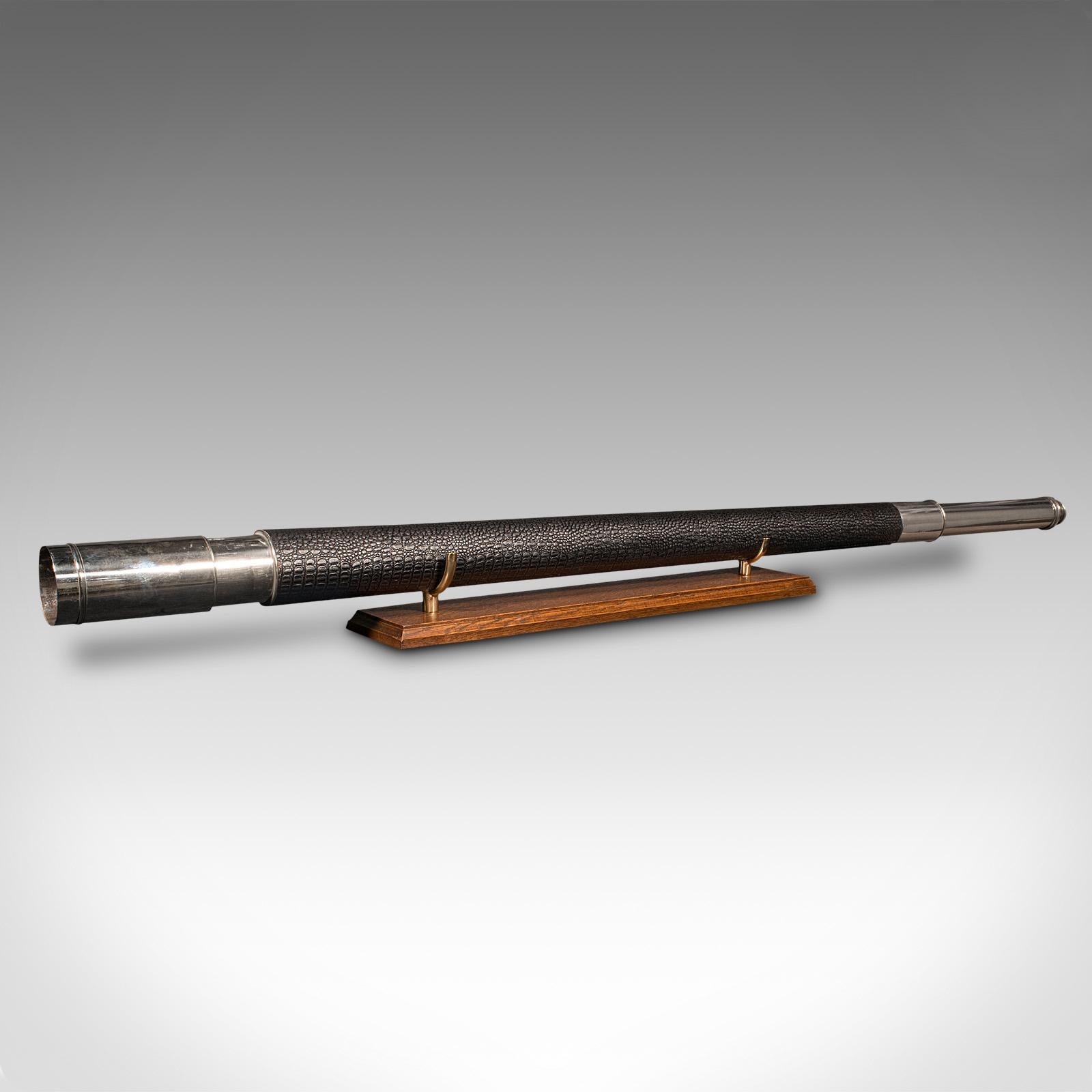 This is a long antique telescope. An English, silvered brass single draw refractor by Dennis of London, dating to the early Victorian period and later, circa 1850.

Perfect for bird watching, landscape appreciation, wildlife, or maritime