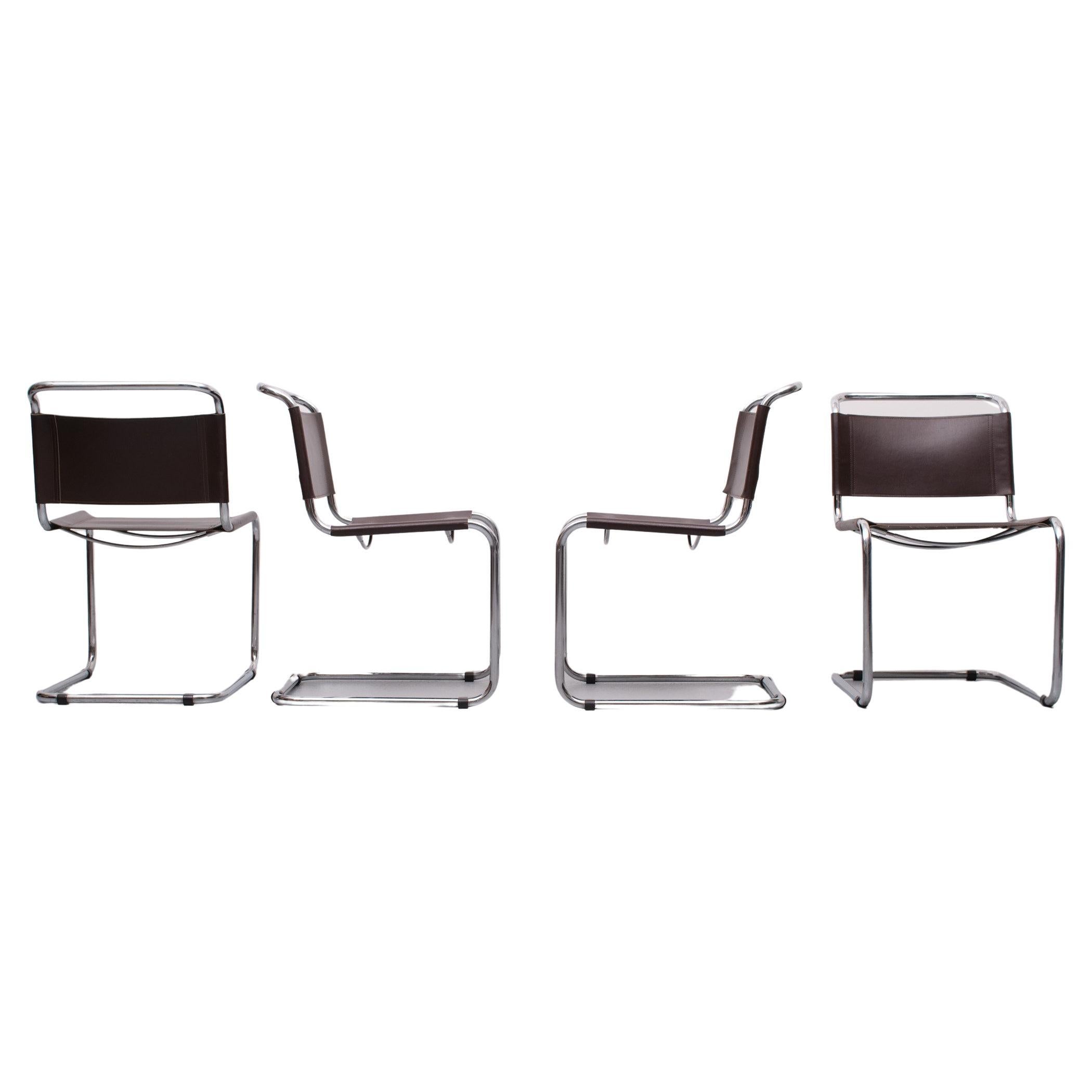 A set of 4 cantilever chairs Designed by Mart Stam 
These chairs have a cantilevered Chrome tubular metal frame with dark brown saddle leather seating and backrest. Good seating comfort. 
Bauhaus design mid century very good condition.

