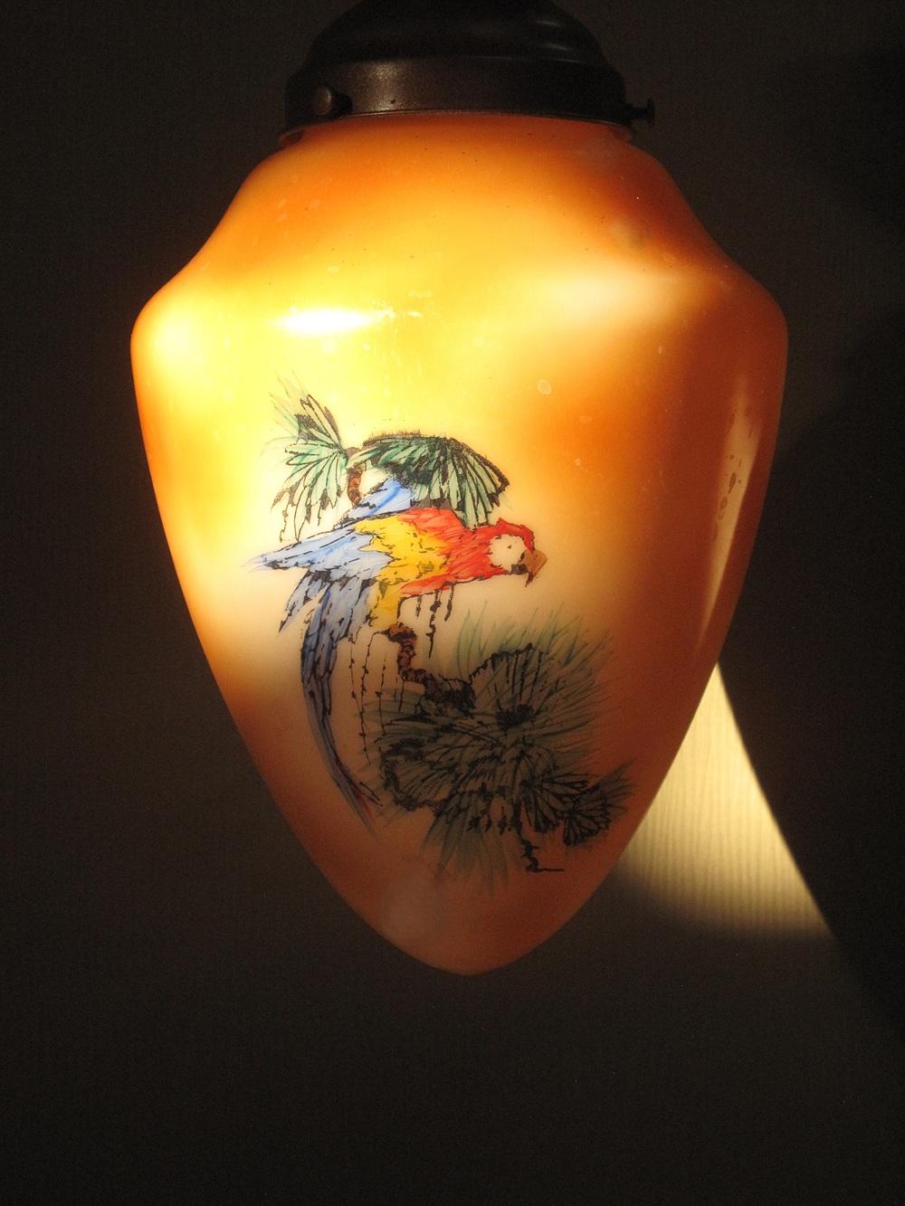 Priced for each unit.
Four matching globes with an image of the Scarlett Macaw parrot painted & fired on on two sides. Design on all is in very good condition with little loss of paint. No cracks on any and no noticeable chips.
Shown on a semi-flush
