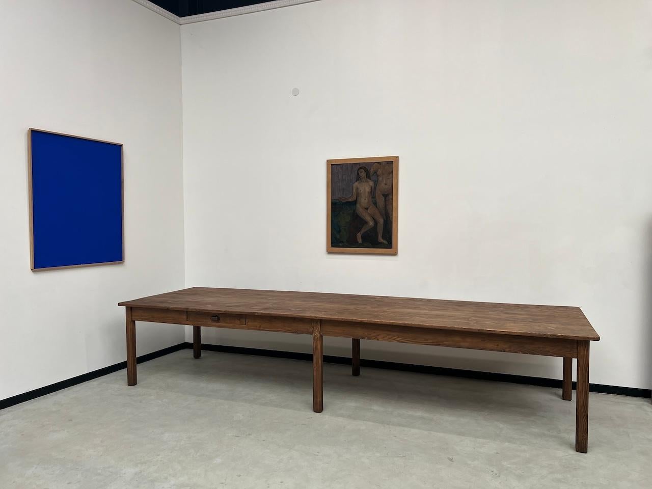 Maison Lecan presents this superb table with very generous dimensions in solid pine from the 1950s allowing for XXL tables. Its great length of 4 meters coupled with a depth of 1.20 meters allows multiple configurations and makes it very suitable