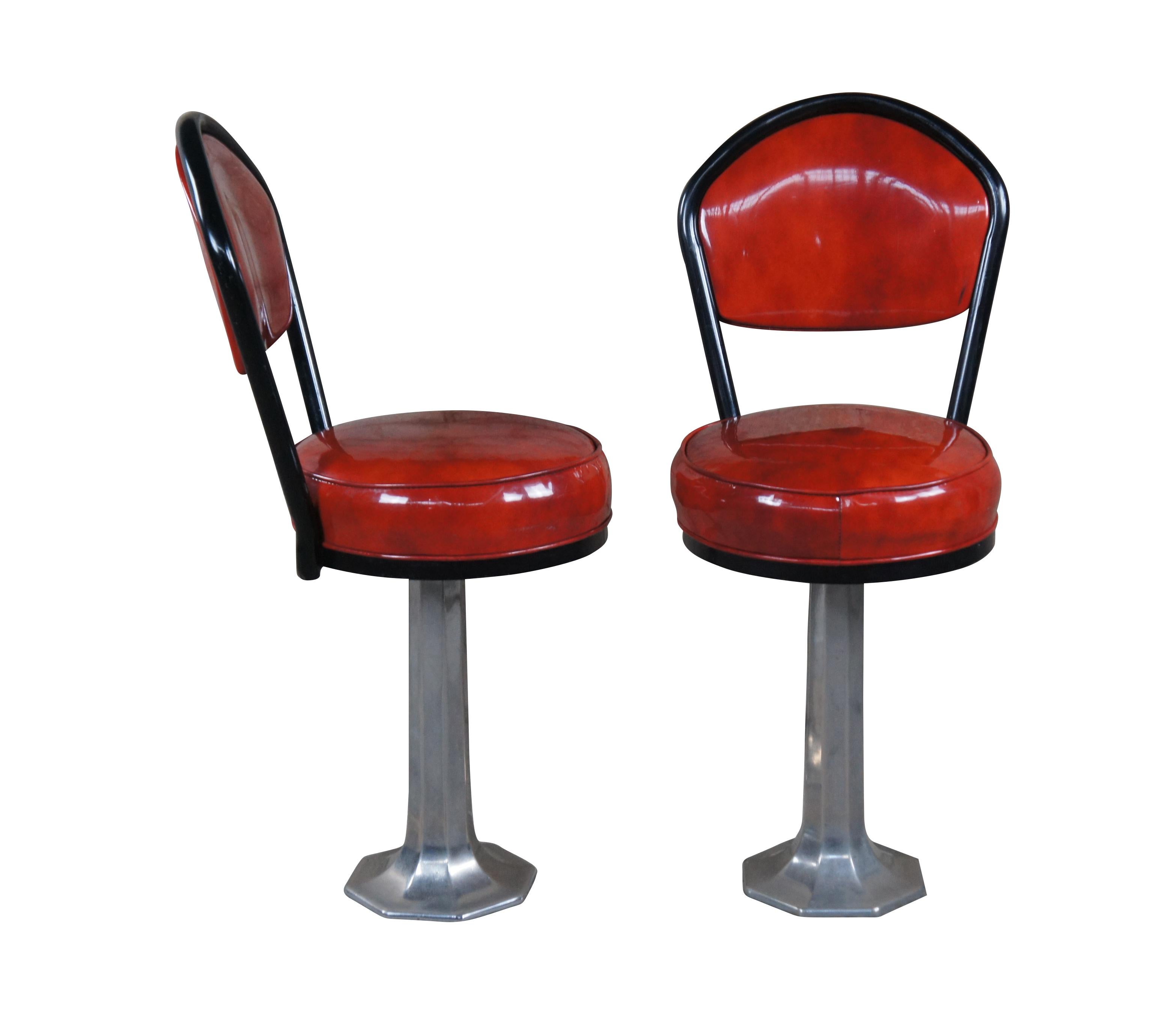 Set of 4 of Late Art Deco Retro Soda / Fountain stools by Chromodern (no. 14).  Made with a baked enamel fiinish over aluminumn base and red seats.  Each stool swivels.

Dimensions:
19