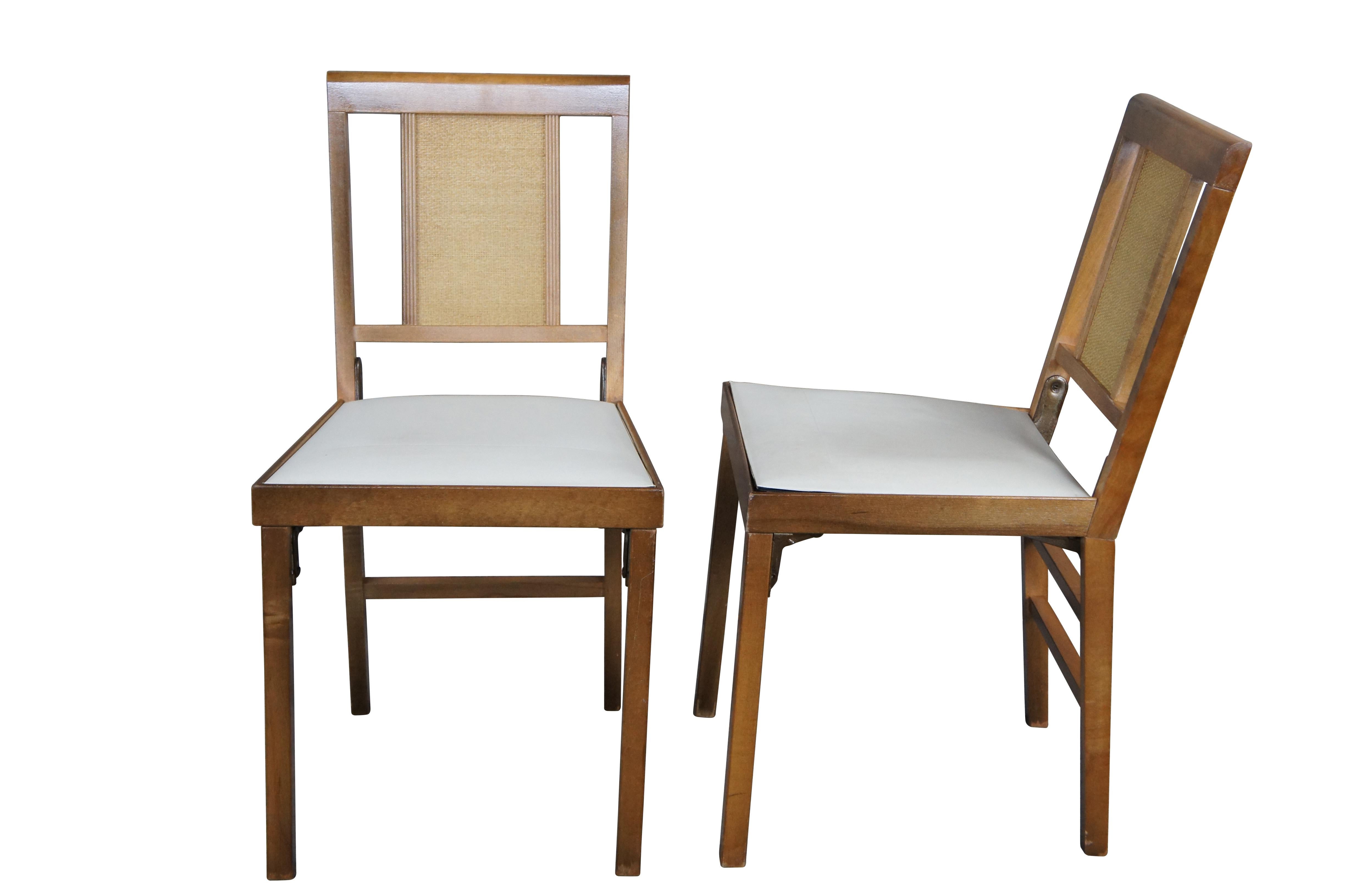 Four mid century Leg o matic folding side chairs.  Made of walnut featuring woven wicker rattan backs with vinyl seat and metal hinges. 

Leg-O-Matic was a division of Lorraine Ind., Bridgeport Conn. From the 1940s to the 1970s, they produced