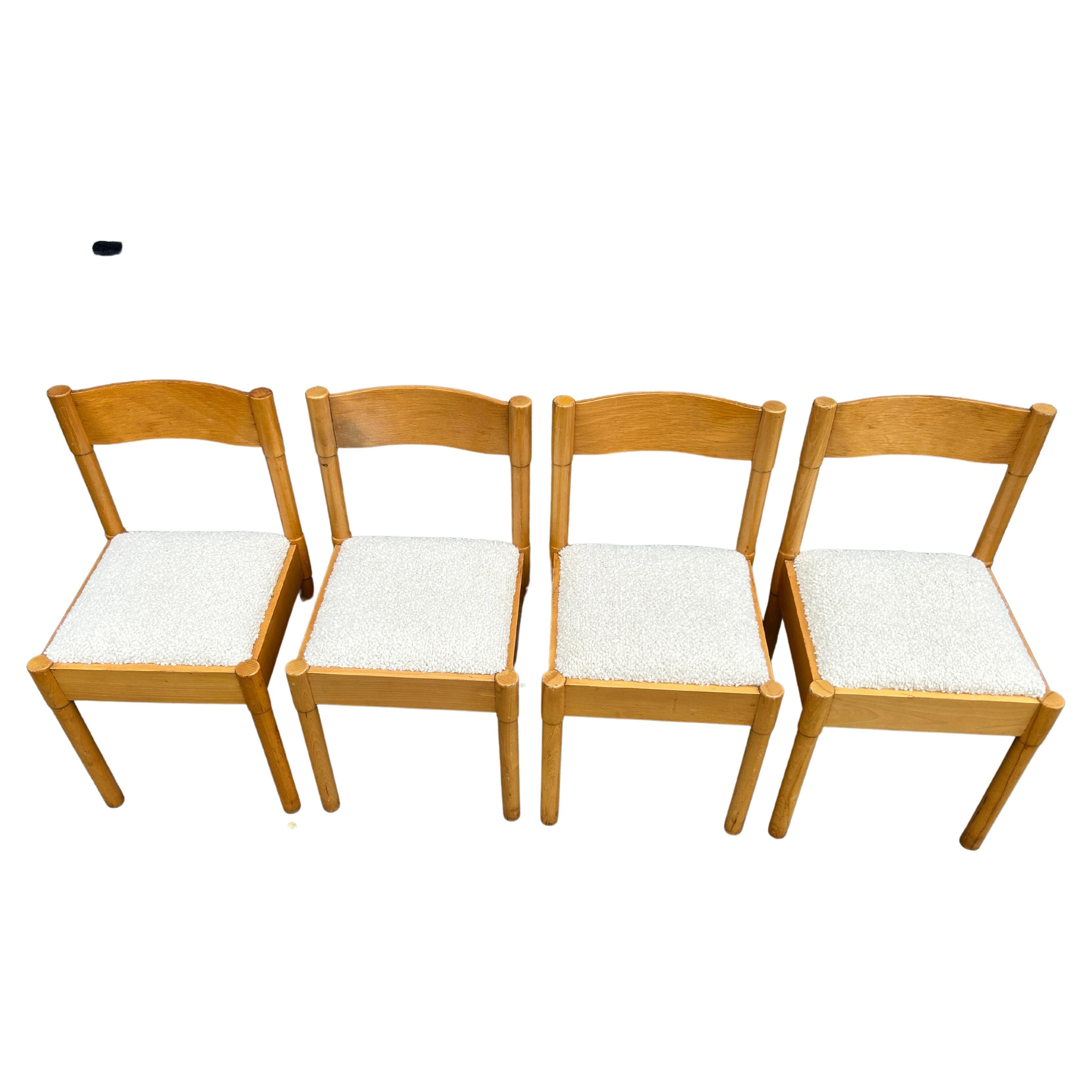 Beautiful set of (4) Mid-Century Modern blonde birch dining chairs with bouclé style of Cassina. Great set of simple solid Birch with bentwood back rest. Upholstery is Holly Hunt Alpaca bouclé. Round dowel construction legs and back support. Show
