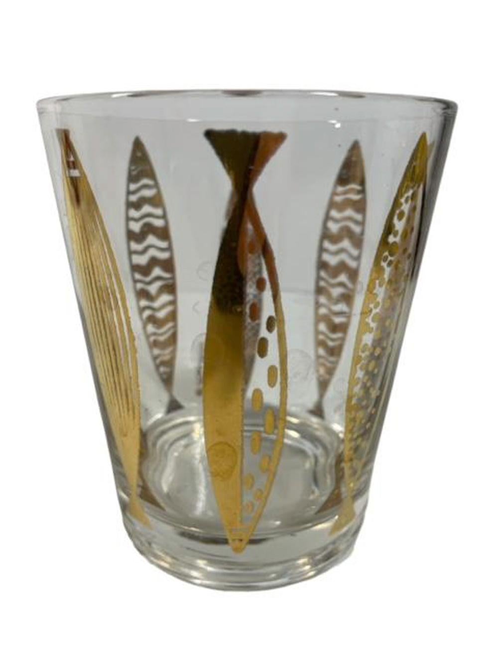 Set of 4 double old fashioned glasses designed by Fred Press with 22 karat gold fish with various abstract patterns on clear glass.
