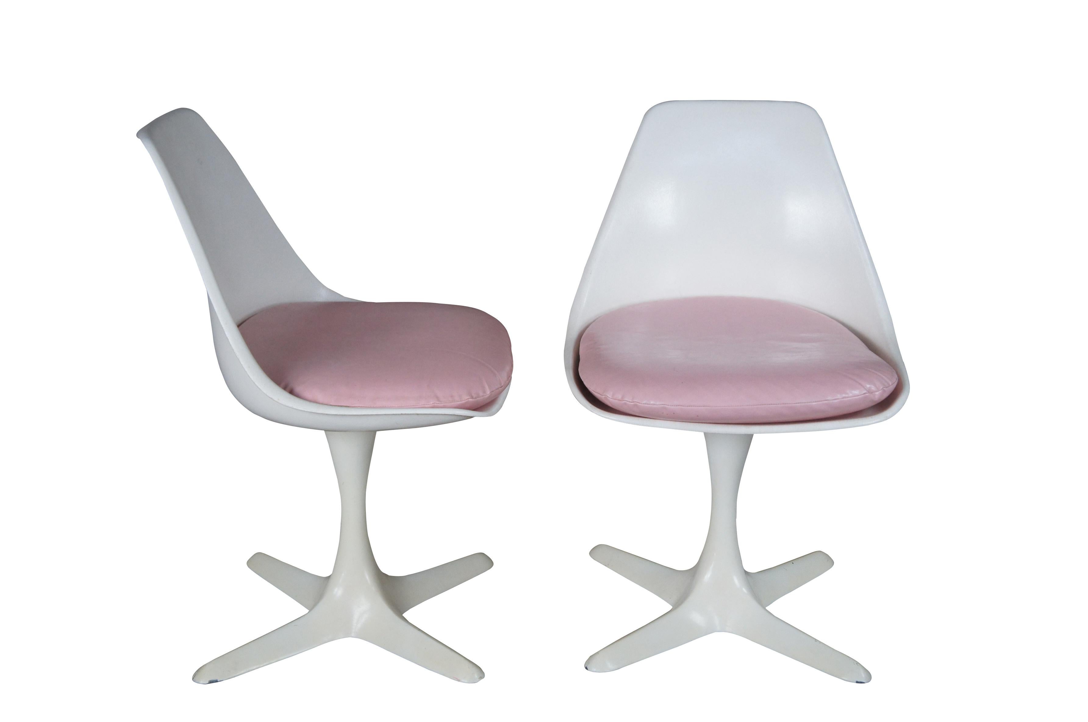 Four original mid century Burke Inc. tulip shell chairs featuring the iconic star design in white with pink vinyl cushions.  Made in Dallas Texas.  Model 115 of the Star Trek series.

Burke Inc. (1959 - 1963)
Maurice’s first successful solo venture,