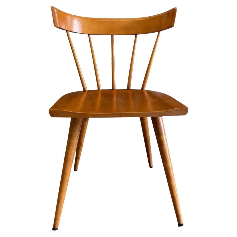 Set of 4 All original midcentury maple Paul McCobb Planner Group spindle back side chairs. Solid maple seat and curved back on tapered legs. Original vintage condition. Original blonde finish. These chairs are labeled Paul McCobb by Winchendon