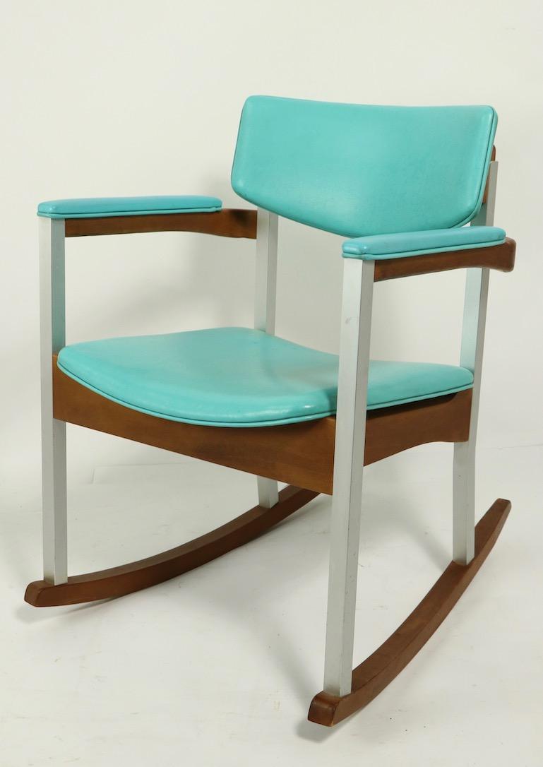 Unusual and rare model Thonet wood, aluminum and vinyl rocking chairs, total of four available, three in green vinyl, one in turquoise vinyl upholstery. Build to commercial standards, solid and sturdy, clean and ready to use condition. Offered and