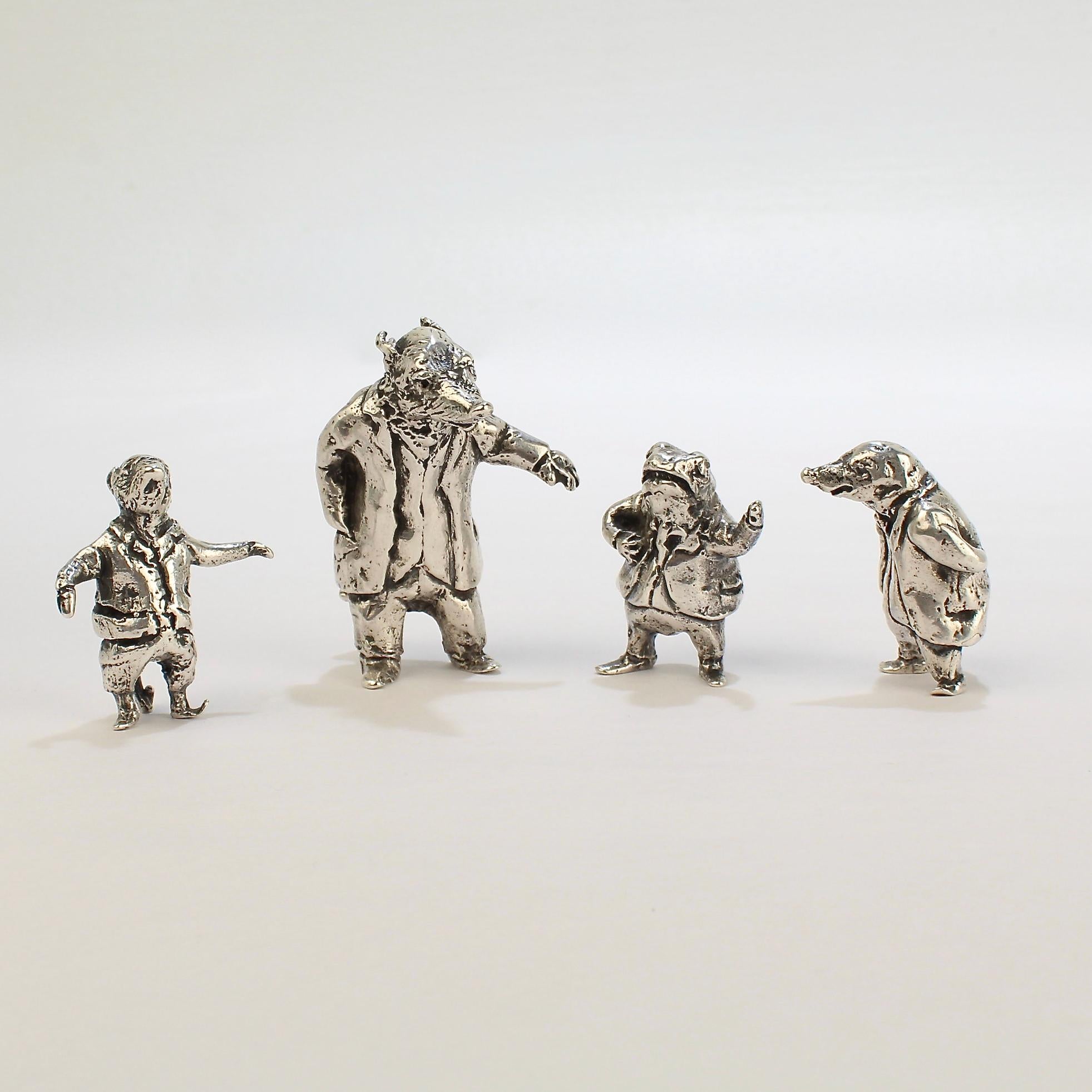 A very fine vintage set of Wind in the Willows sterling silver miniature sculptures or figurines.

The set includes the story book characters of Toad, Badger, Ratty and Mole. 

They were cast by Sterling E. Lanier, a noted author and sculptor.