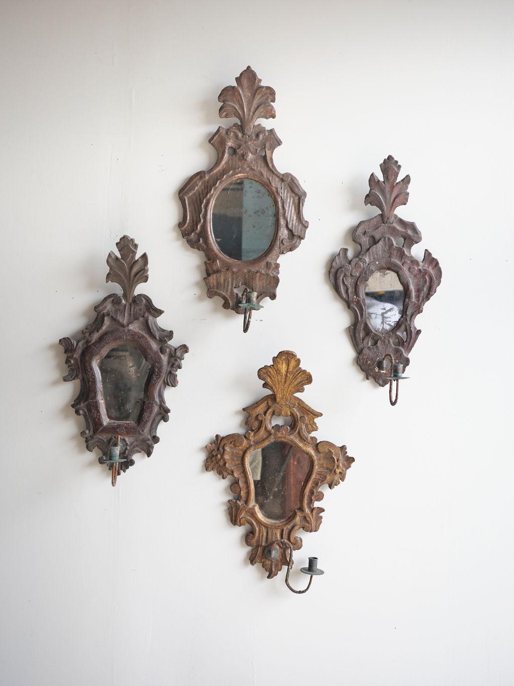 4 French Louis XV carved bronze wood mirrored decorative wall sconces, crafted in the 19th century, would make a lovely addition to your home. They all 4 vary in size and each one has a different coloring/look to them. They are not all exactly