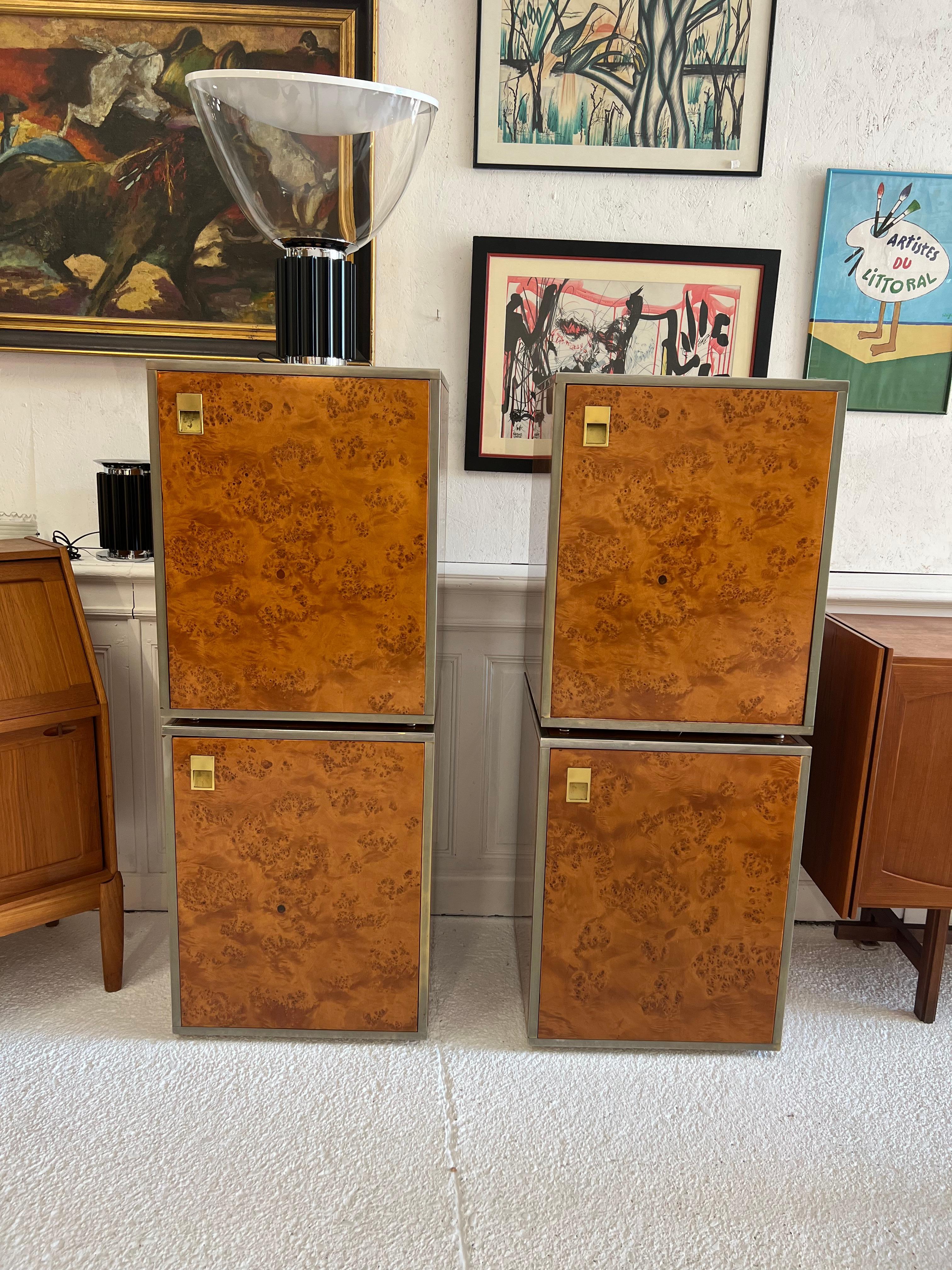 4 Willy Rizzo modules from the 70s
they can be presented individually or in a row of 2, 3 or 4 elements
the 4 elements are covered with a pretty formica 70 imitating wood on its 4 sides and the frames are in brass

Willy Rizzo is an