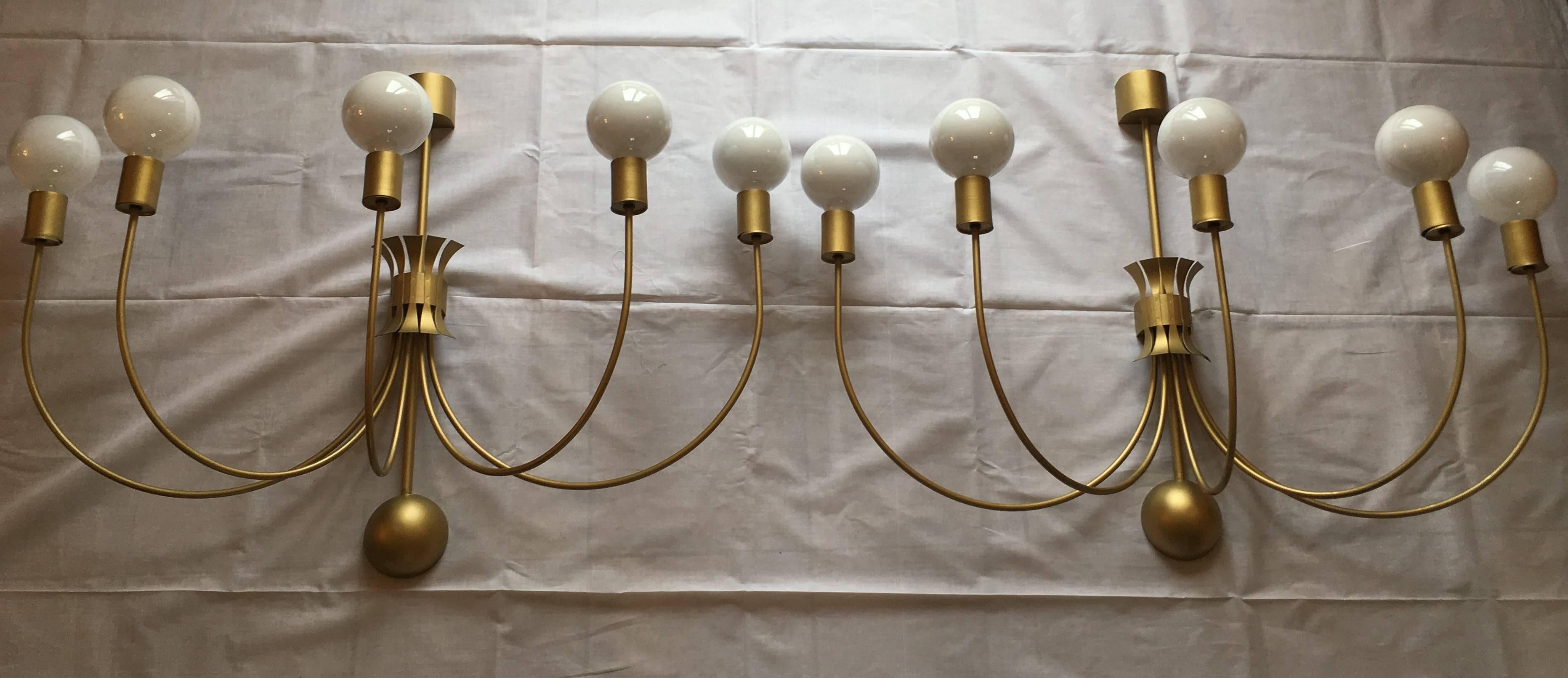 Very rare set of four monumental wall lamps, installed in 1952 in a famous French theatre in Normandy. In the style of Jean Royère, each sconce has five elegant curved arms electrified.
Perfect set to decorate a loft or illuminate large