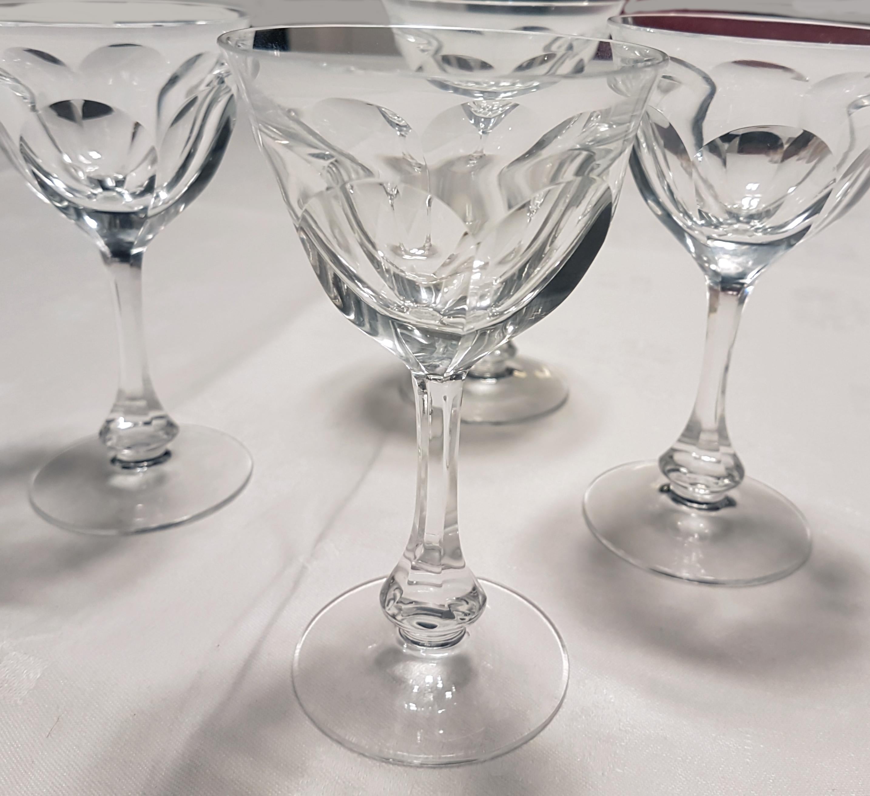 These are 4 liquor glasses or small wine glasses made from hand blown crystal by Moser in the ever popular Lady Hamilton glass cut.

This pattern is an example of the 