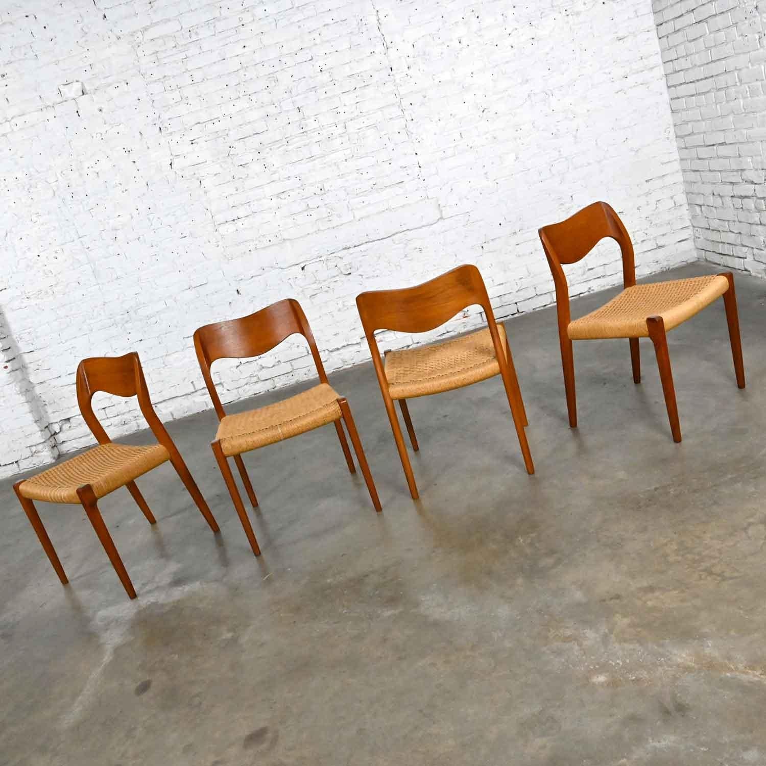 Awesome Neils O Moeller Scandinavian Modern Model 71 teak dining chairs by J.L. Mollers Mobelfabrik set of 4. Beautiful condition, keeping in mind that these are vintage and not new so will have signs of use and wear. We have repaired damaged rope