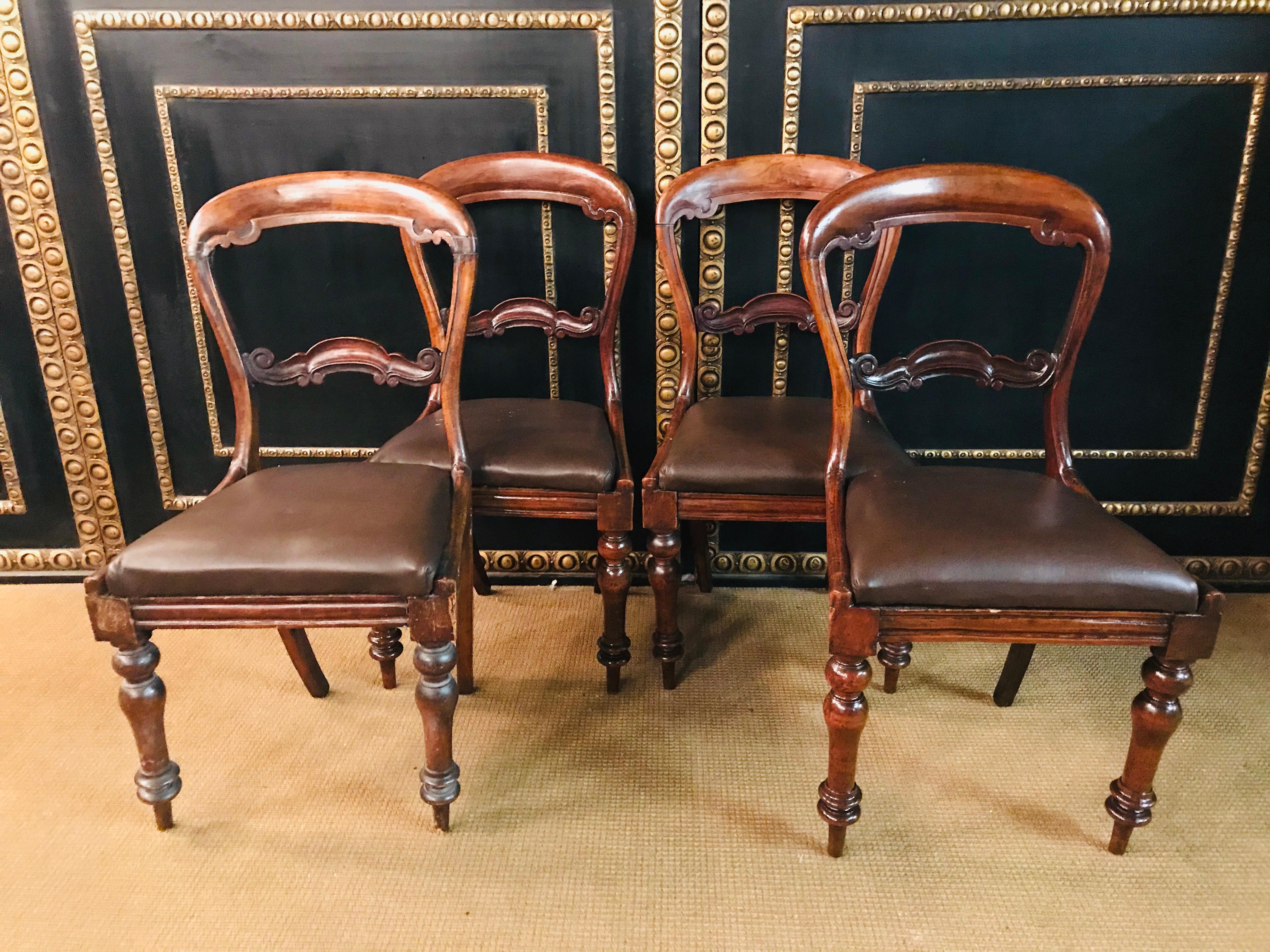 4 original Biedermeier chairs solid mahogany with leather seats.
the front legs are turned.