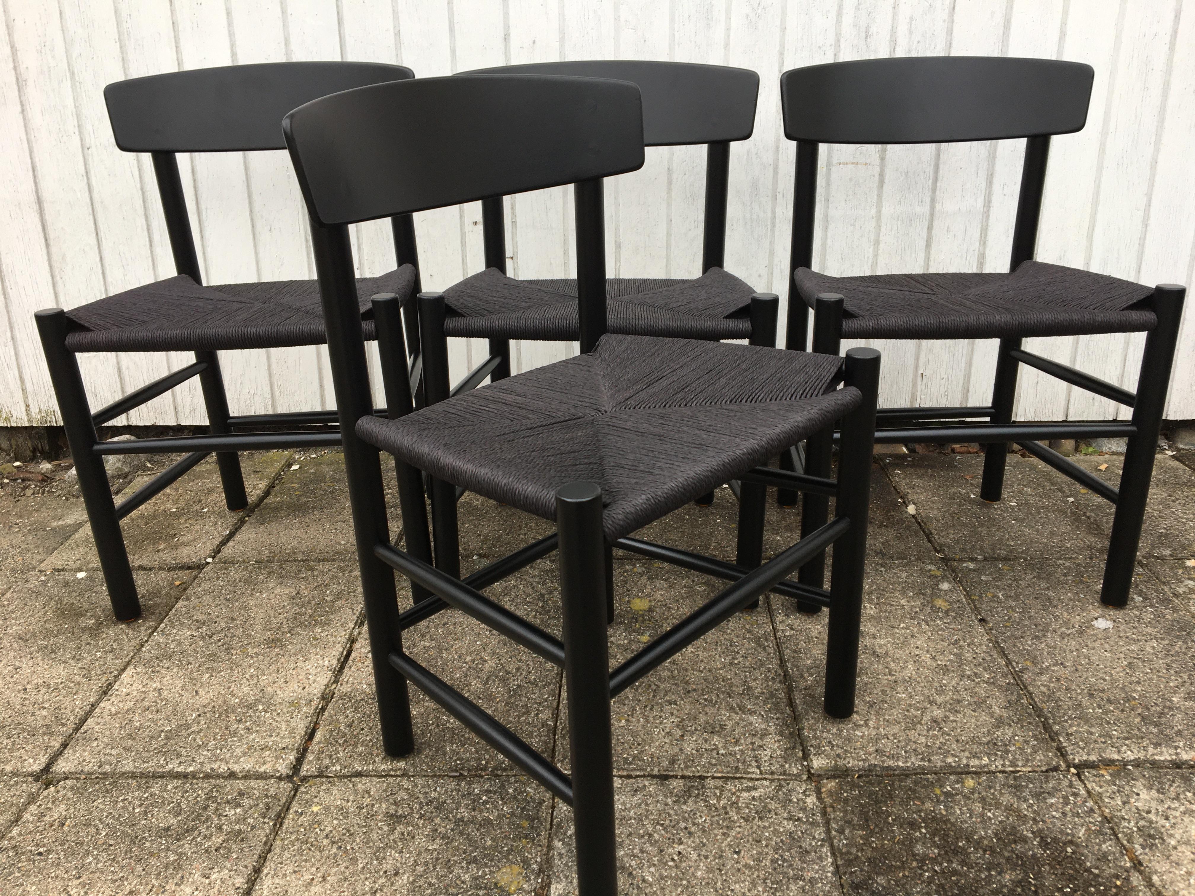 Set of 4 Børge Mogensen 'Folkestol' J39 black varnished and upholstered with new black paper cord.
The chairs are in good condition with new furniture shoes.