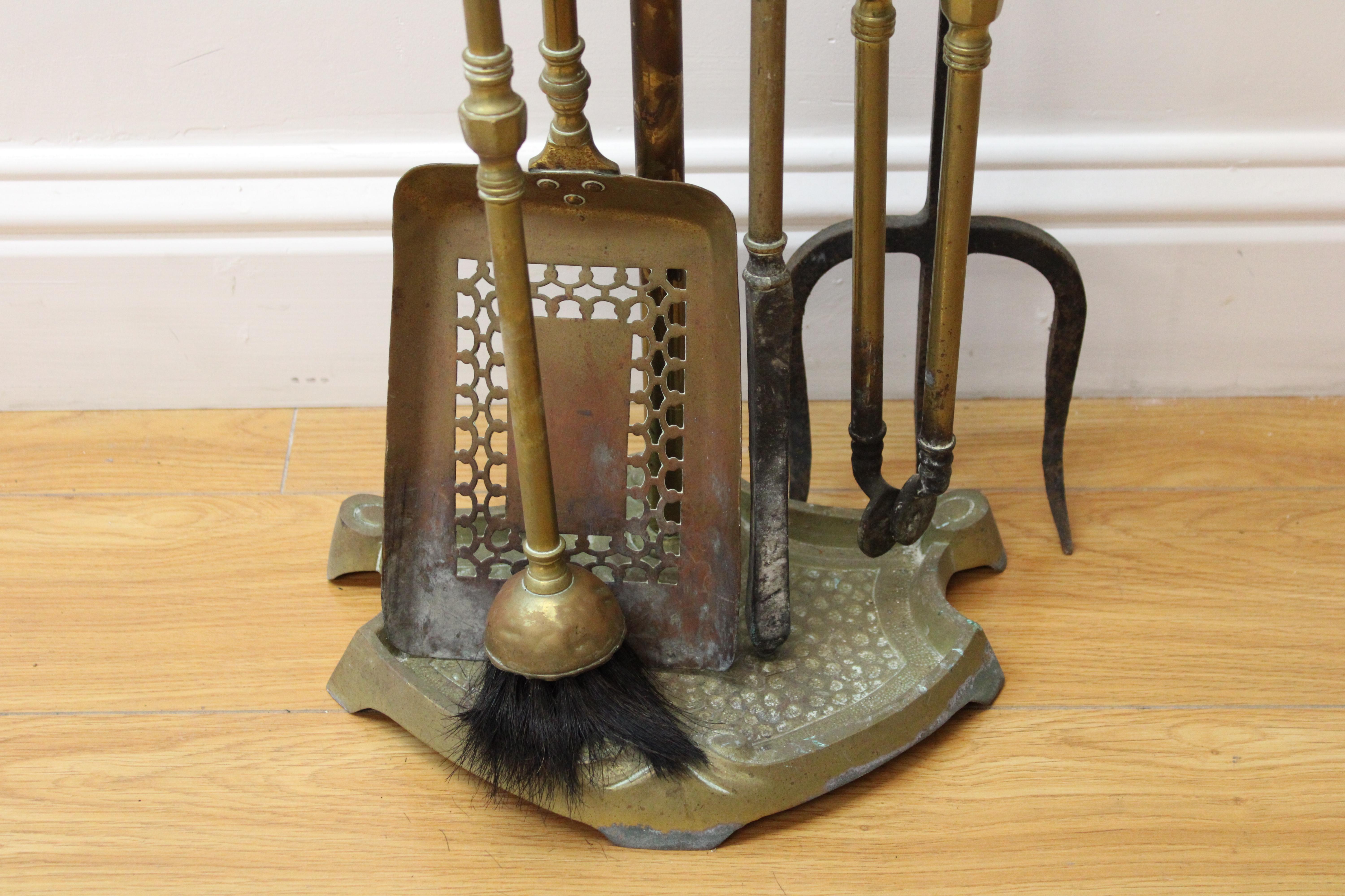 C. 20th Century

4 Piece brass fireplace tool set.