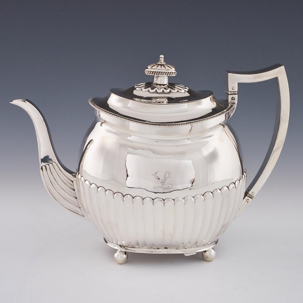 4 Piece George III Sterling Silver Tea and Coffee Service London, 1809

Additional information:
Date : Hallmarked in London For Thomas Wallis II
Period : George III
Origin : London England
Decoration : Rounded rectangular form all set on four ball