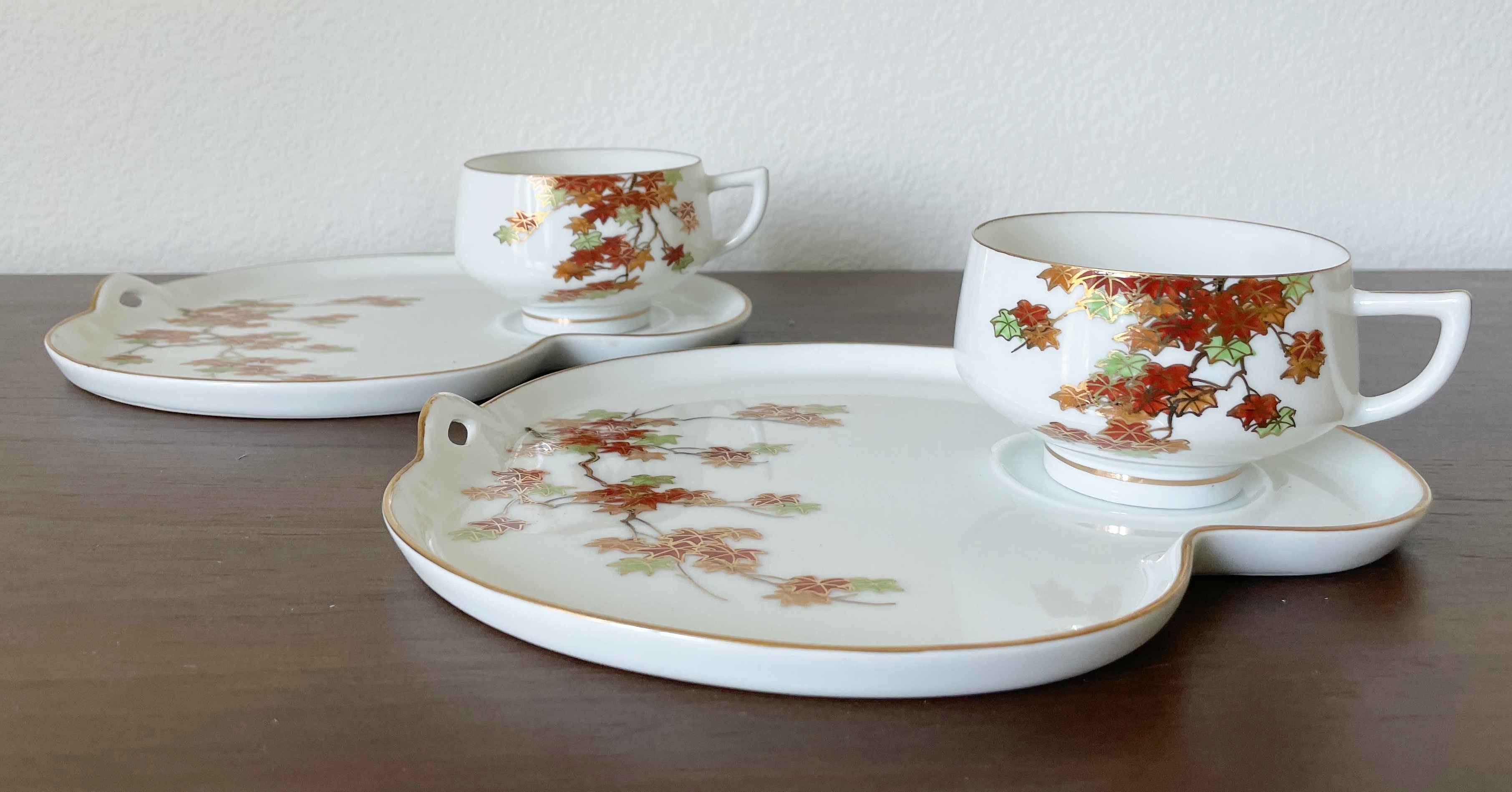 Vintage Koshida tray and teacup set with hand painted maple leaves / Made in Japan circa 1960s
Tea cups feature raised embossed lithophane image of Geisha on inside bottoms
2 trays, width 9 inches, depth 8 inches
2 teacups, width 4.25 inches, depth